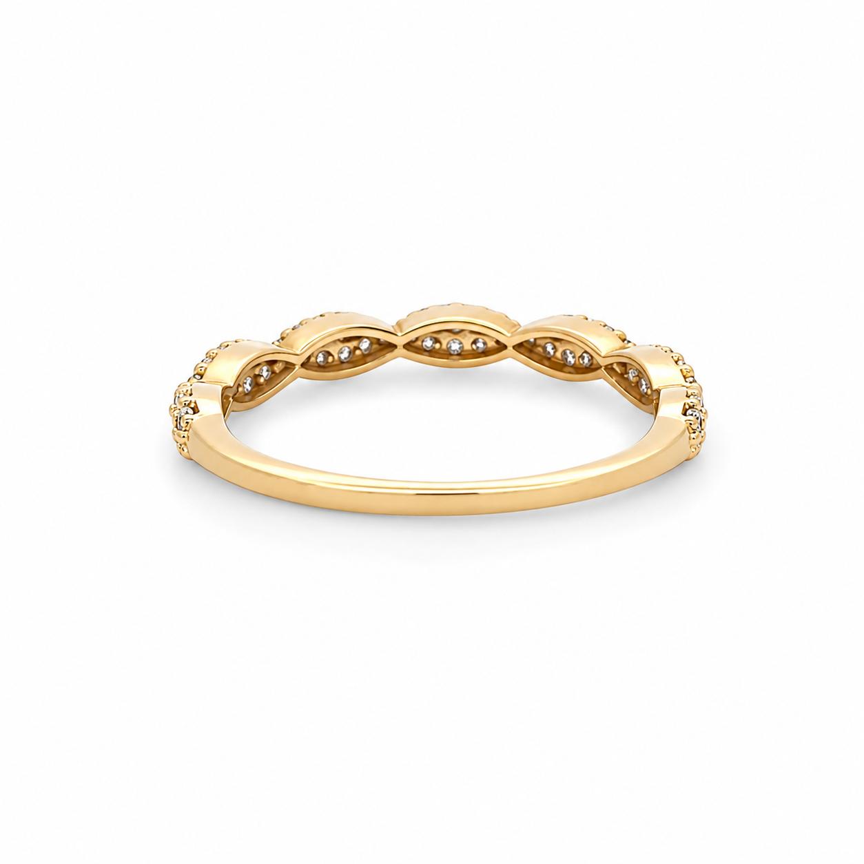 Gold ring with diamond accents on a white background