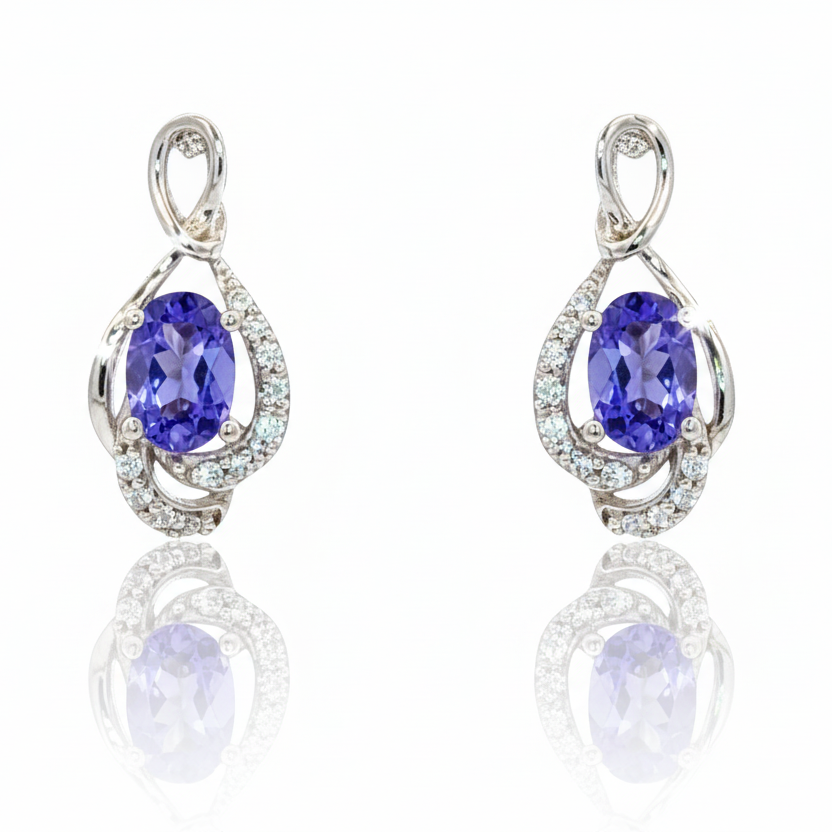 Pair of earrings with blue gemstones on a white background