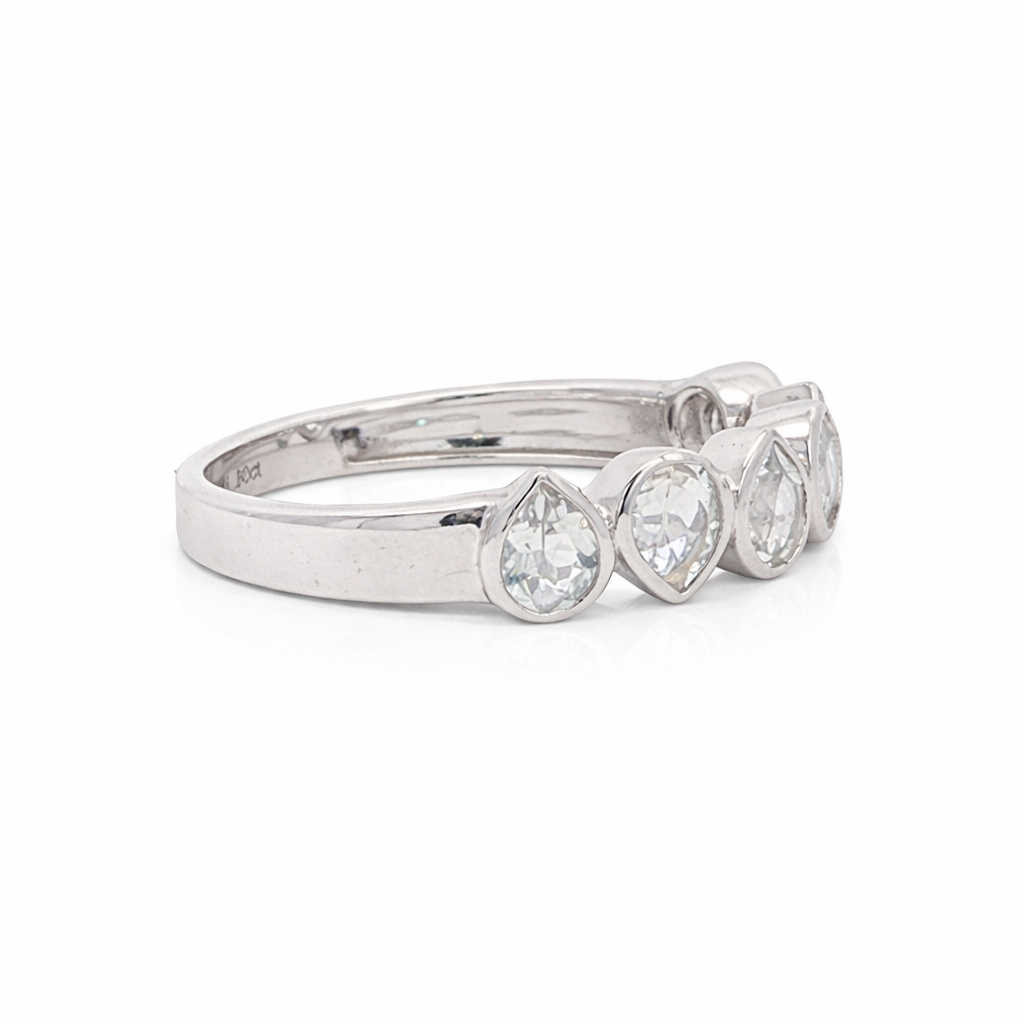 Silver ring with pear-shaped gemstones on a white background