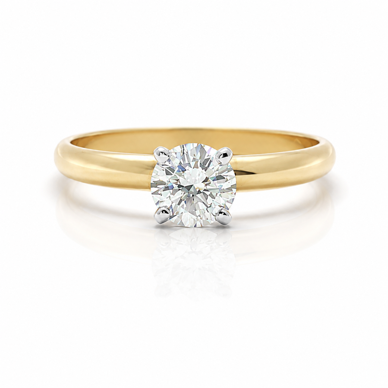 A classic solitaire engagement ring featuring a round brilliant-cut diamond set in a polished yellow gold band, presented on a clean white background with a soft reflection.