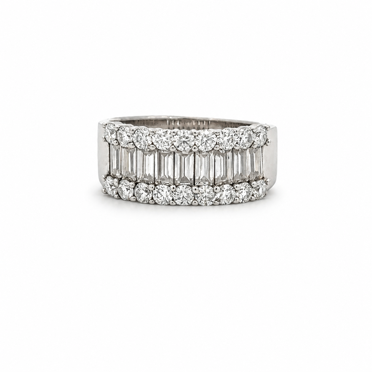 A silver-tone diamond band ring featuring rows of baguette-cut and round-cut diamonds, shown on a plain white background.
