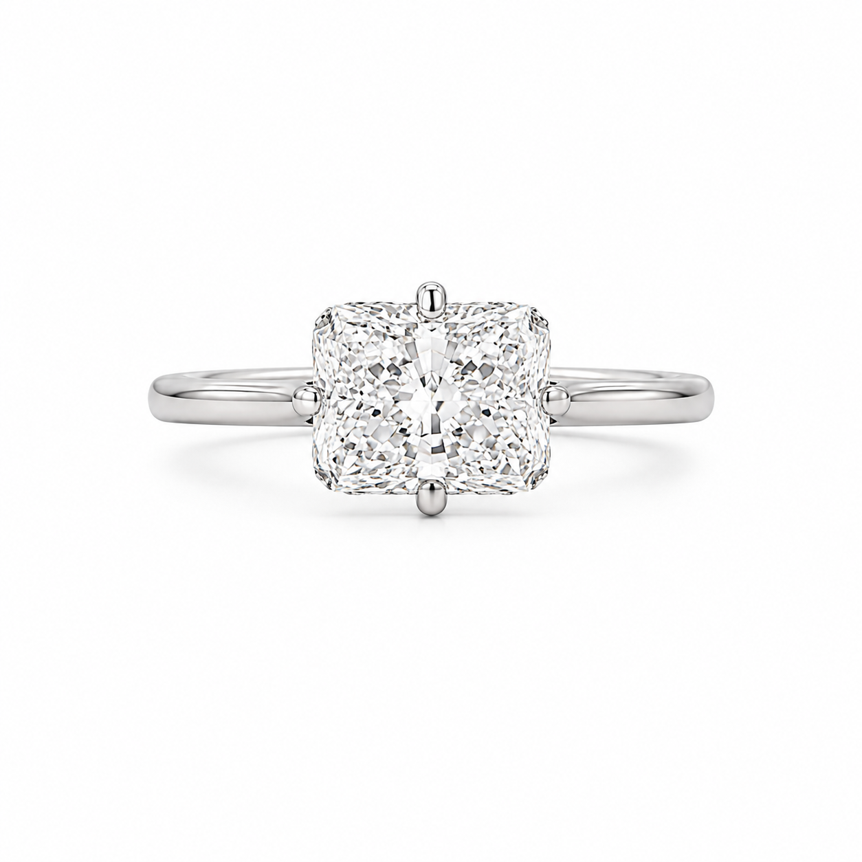 Diamond ring with a cushion-cut diamond on a white background