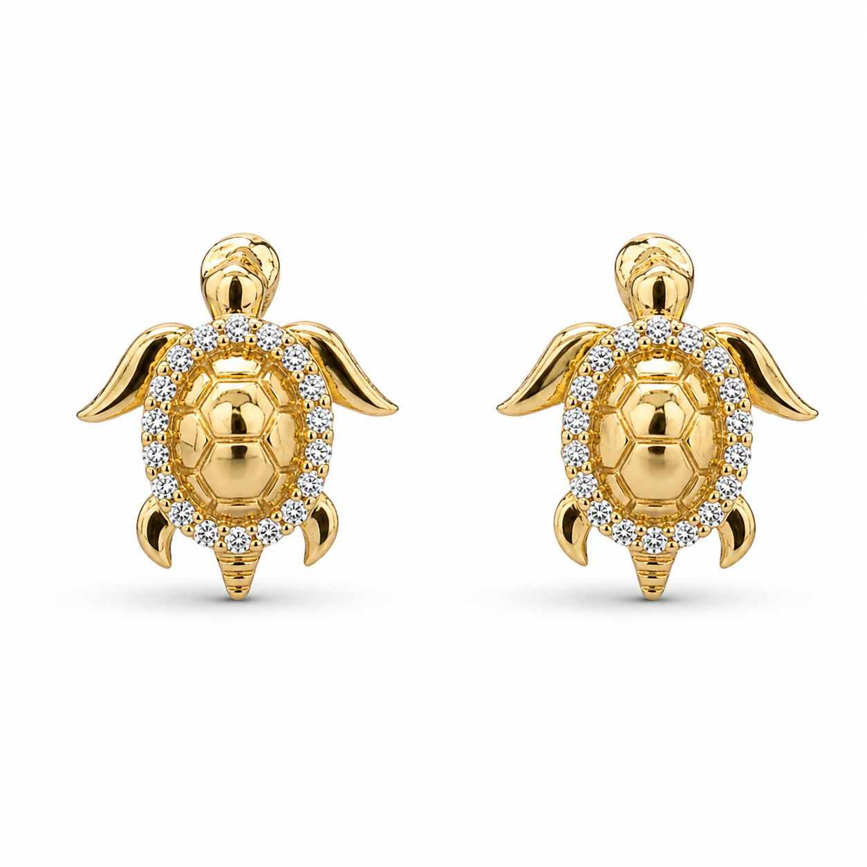 Gold turtle-shaped earrings with diamond accents on a white background