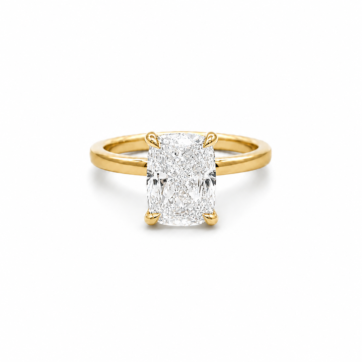 Gold ring with a large diamond on a white background