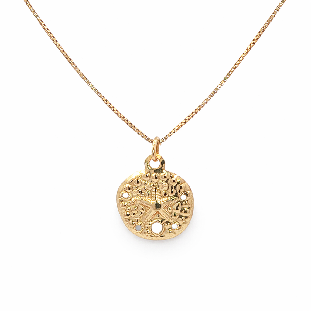 Gold necklace with a detailed pendant on a white background