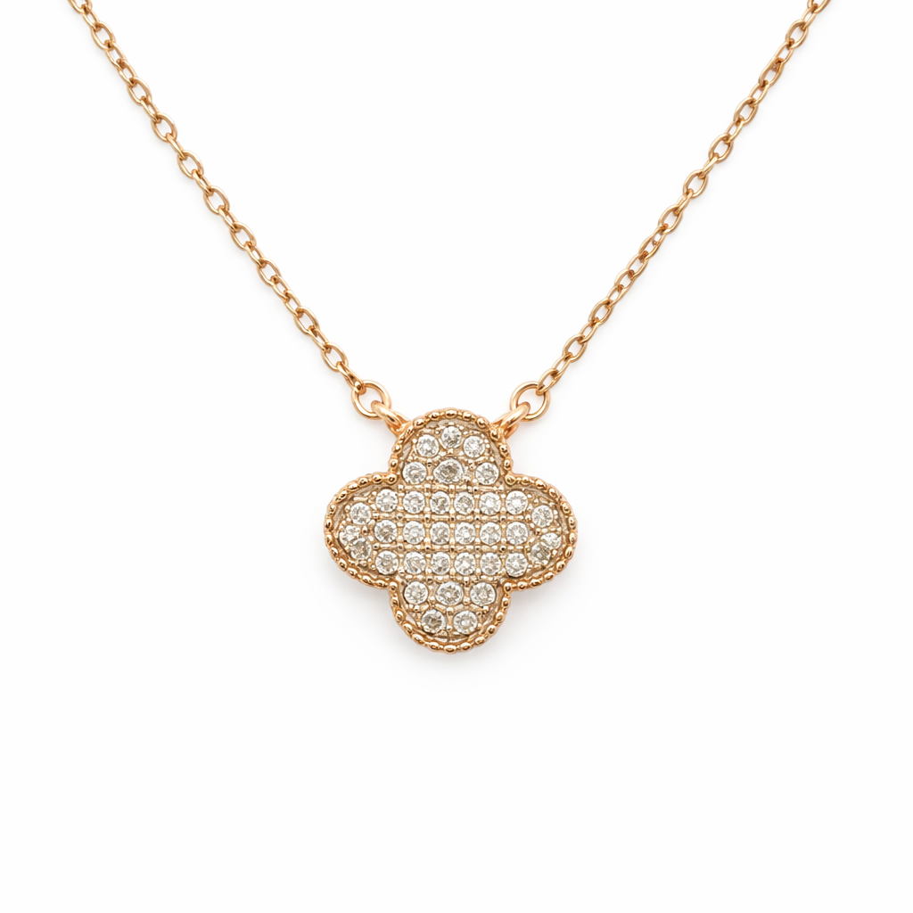 Rose gold necklace with a clover-shaped pendant on a white background