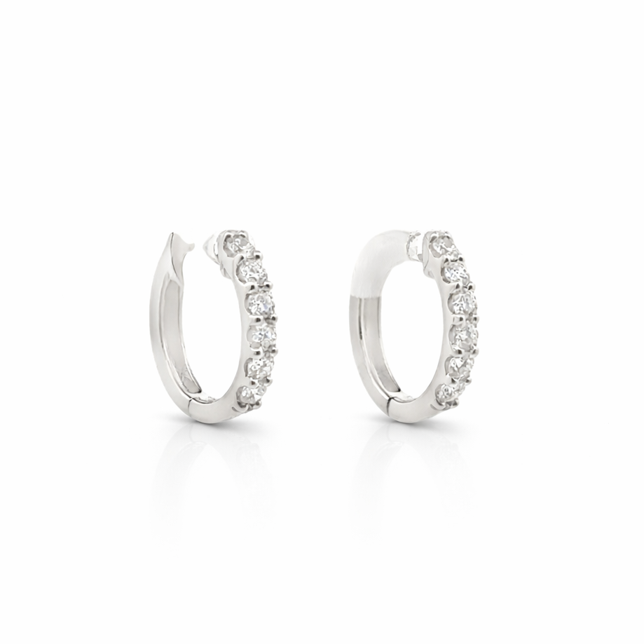 Pair of silver hoop earrings with small diamonds on a white background