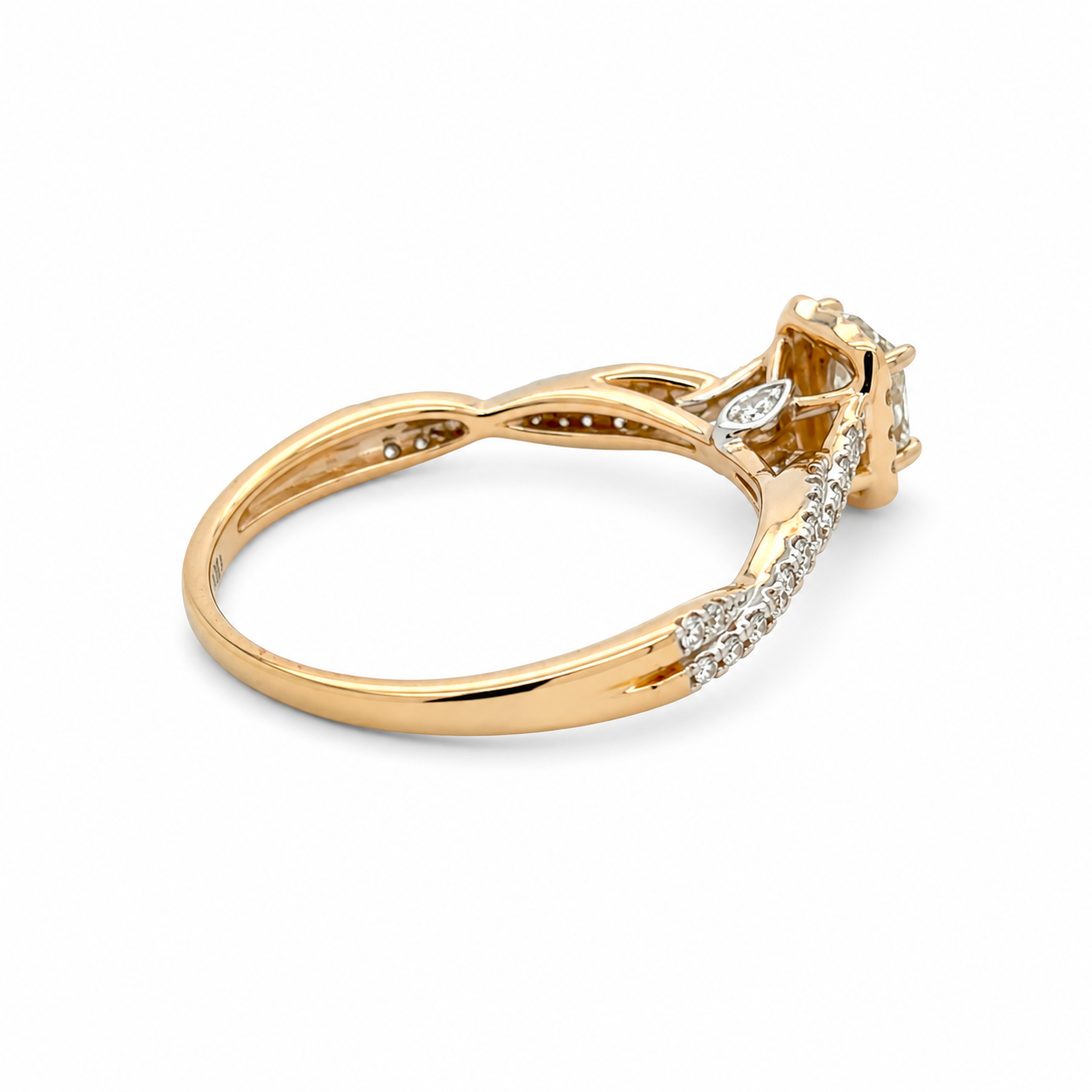 Gold ring with diamond accents on a white background