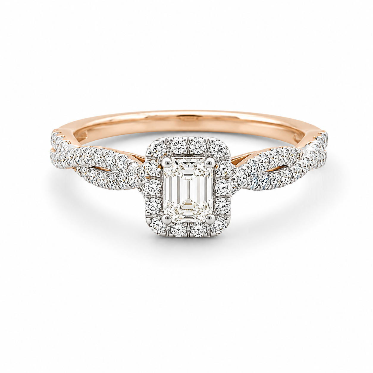 Rose gold ring with emerald-cut diamond and diamond halo on a white background