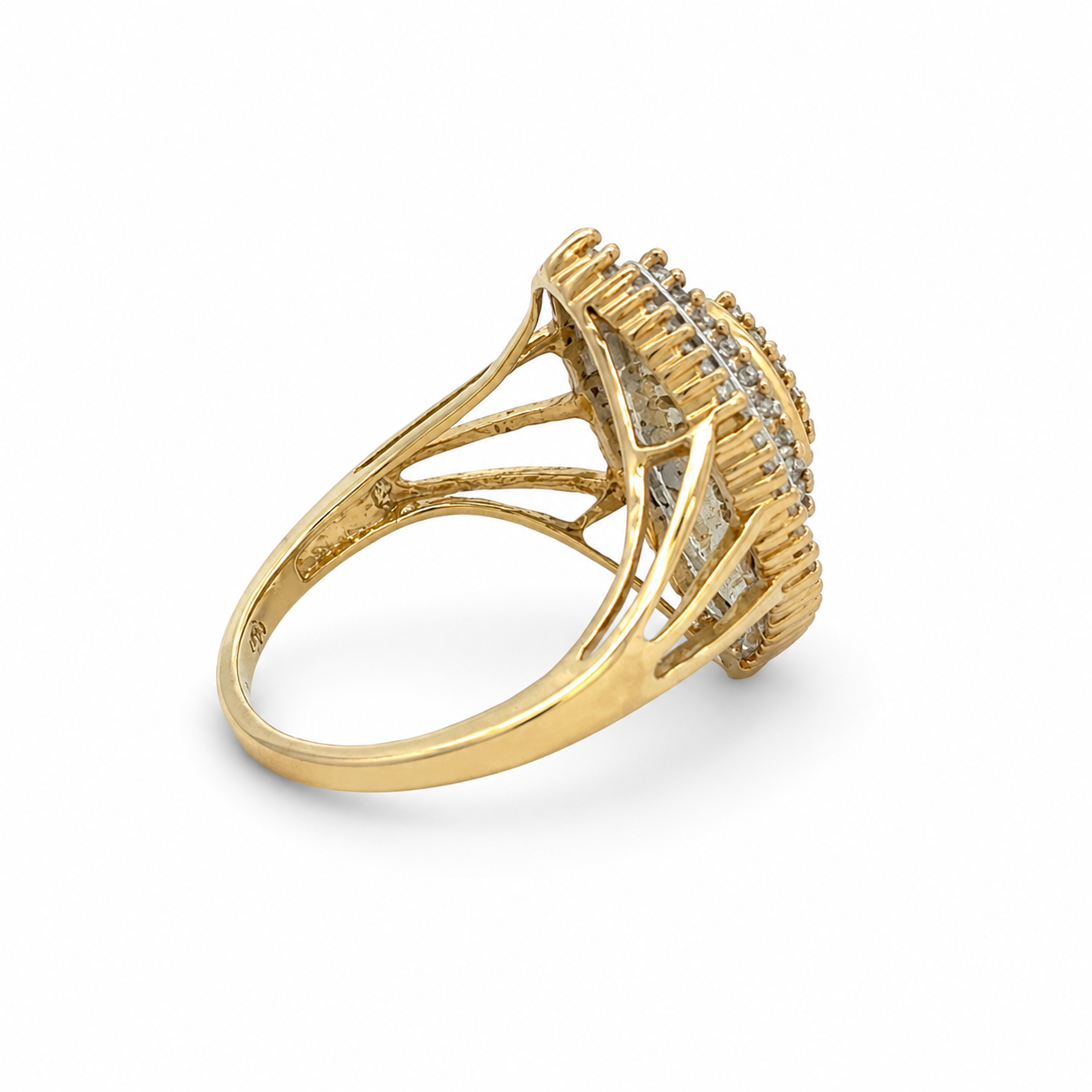Gold ring with diamond accents on a white background