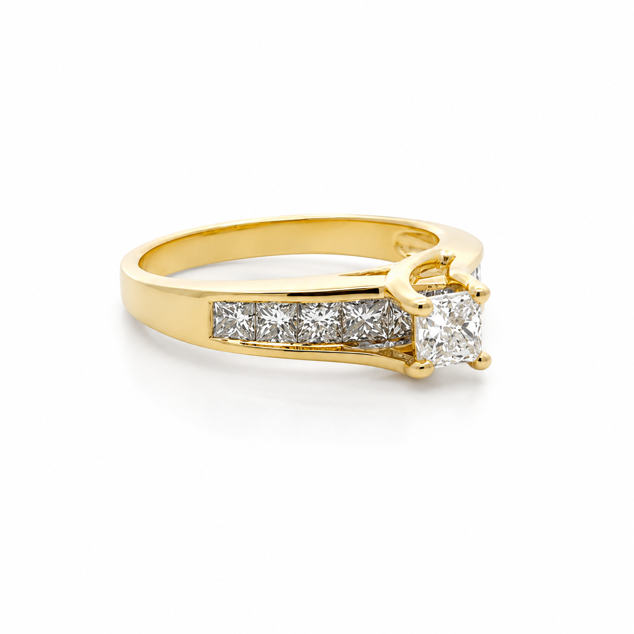 Gold ring with diamond stones on a white background