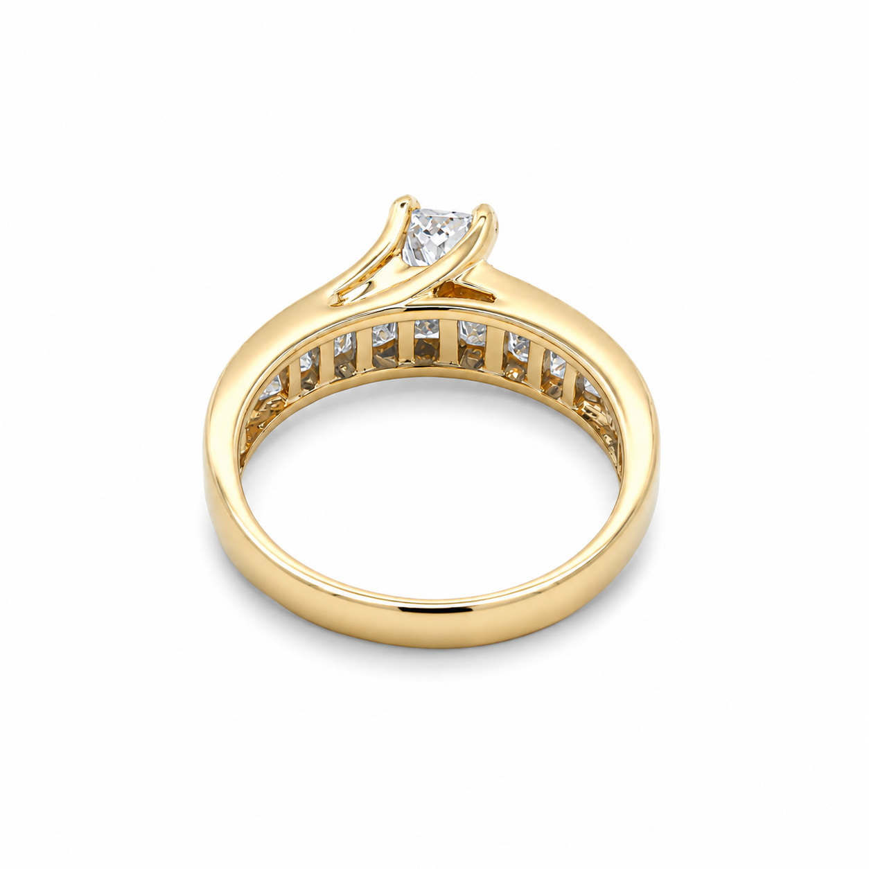 Gold ring with a diamond on a white background