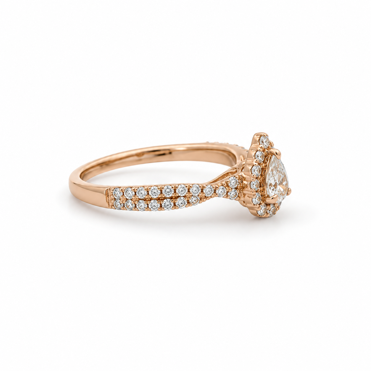 Rose gold ring with a large diamond and smaller diamonds on a white background