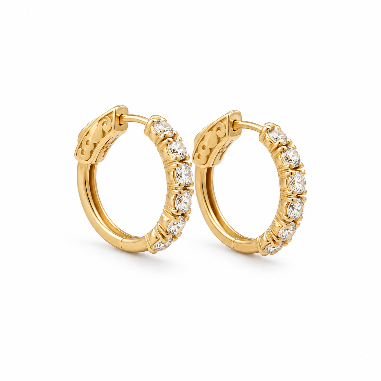 Gold hoop earrings with embedded diamonds on a white background
