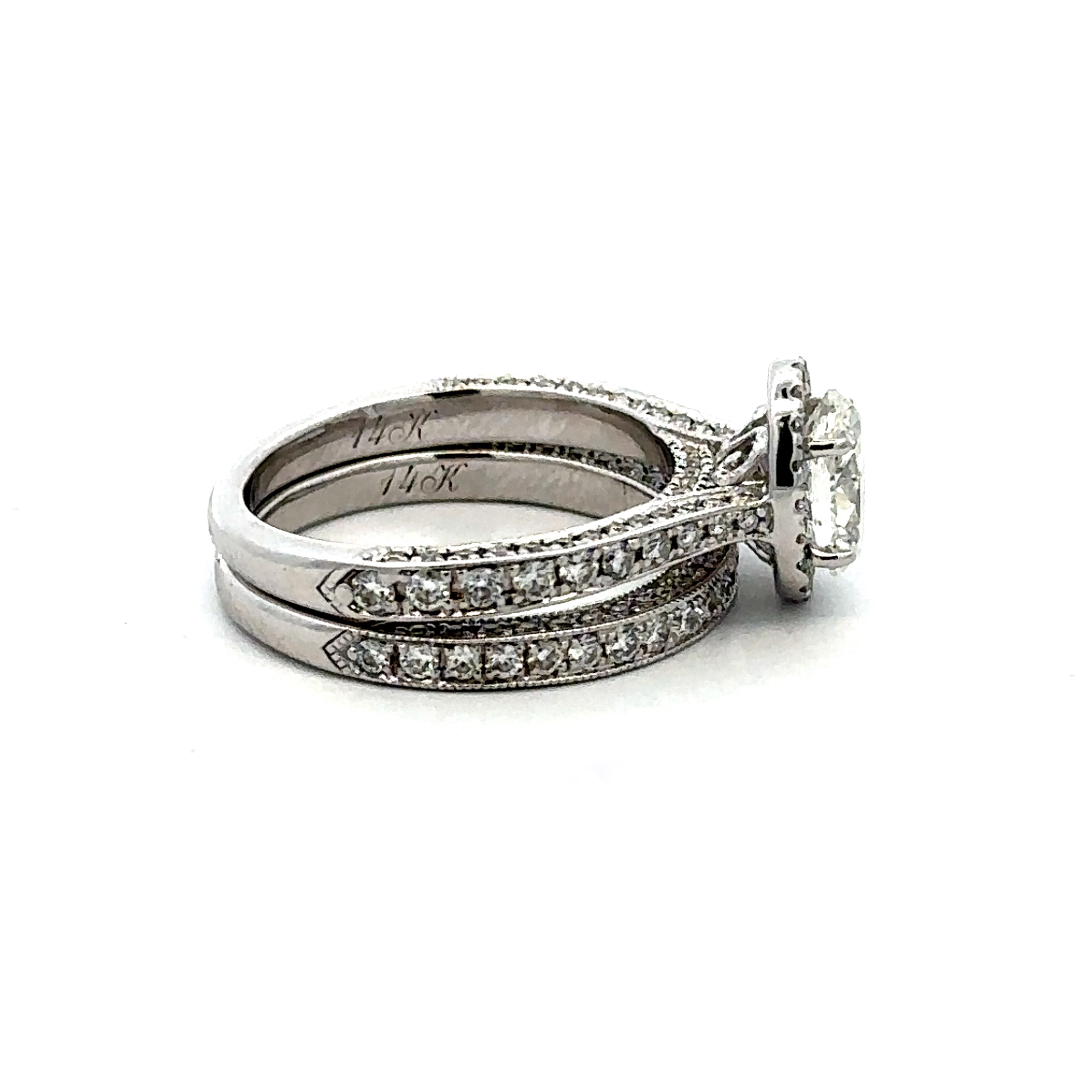 Estate Collection: Neil Lane 14K White Gold Natural Approx. 1.00CT  Oval Center Halo Engagement Ring And Wedding Band Set