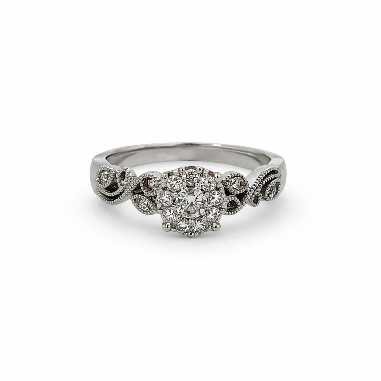 Silver ring with diamond accents on a white background