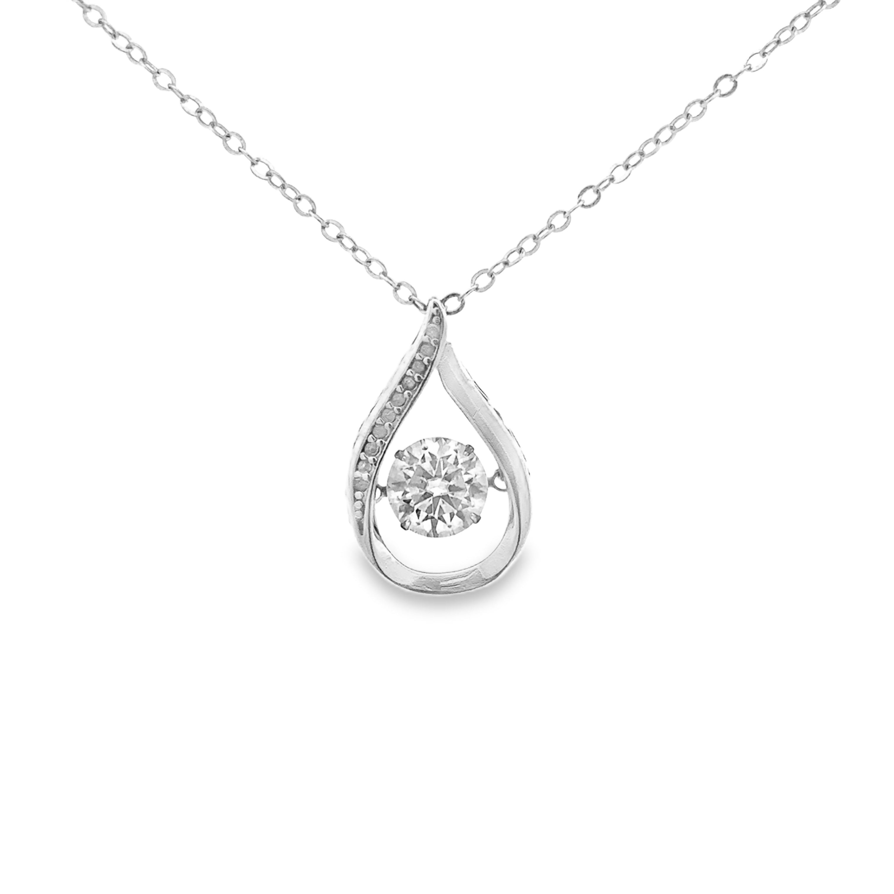 A silver teardrop pendant necklace featuring a round-cut clear center stone and a curved side accent line of small clear stones, suspended from a delicate silver chain against a plain white background.