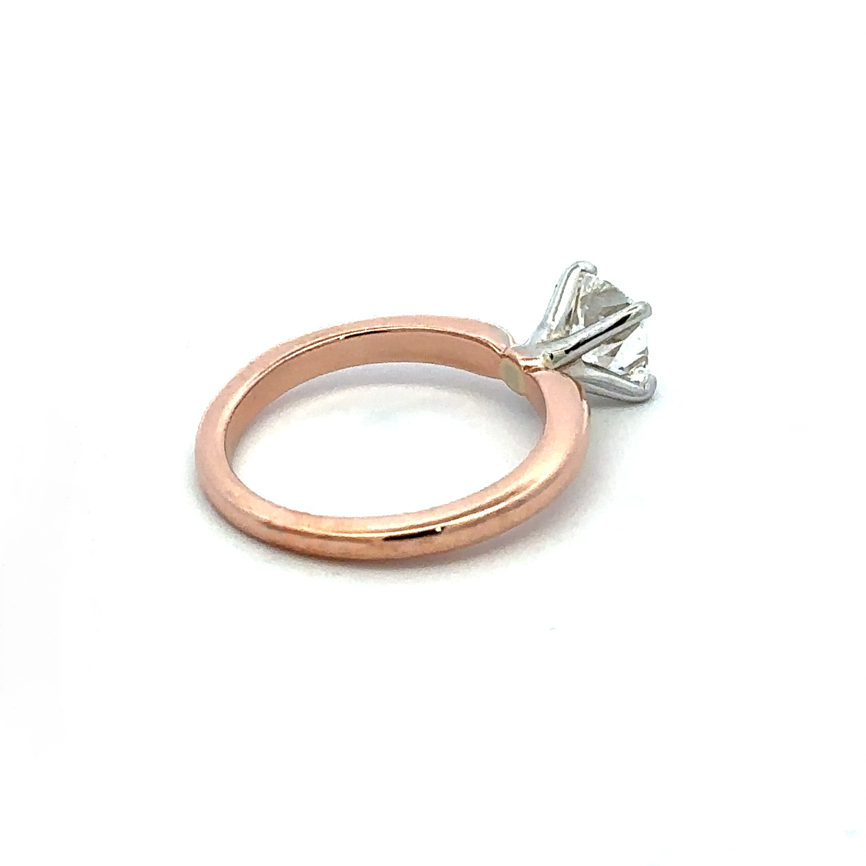 Rose Gold engagement ring on a white background 