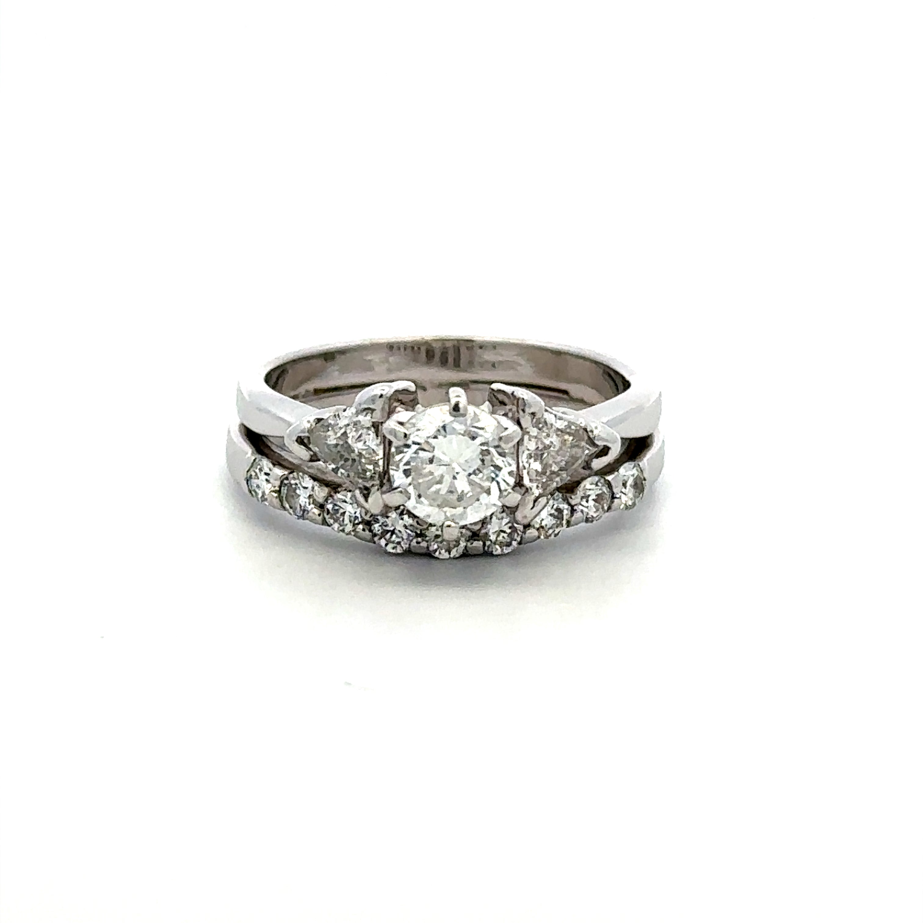 A silver-tone diamond ring set featuring a round center diamond surrounded by smaller diamonds, with a matching diamond band, shown on a plain white background.