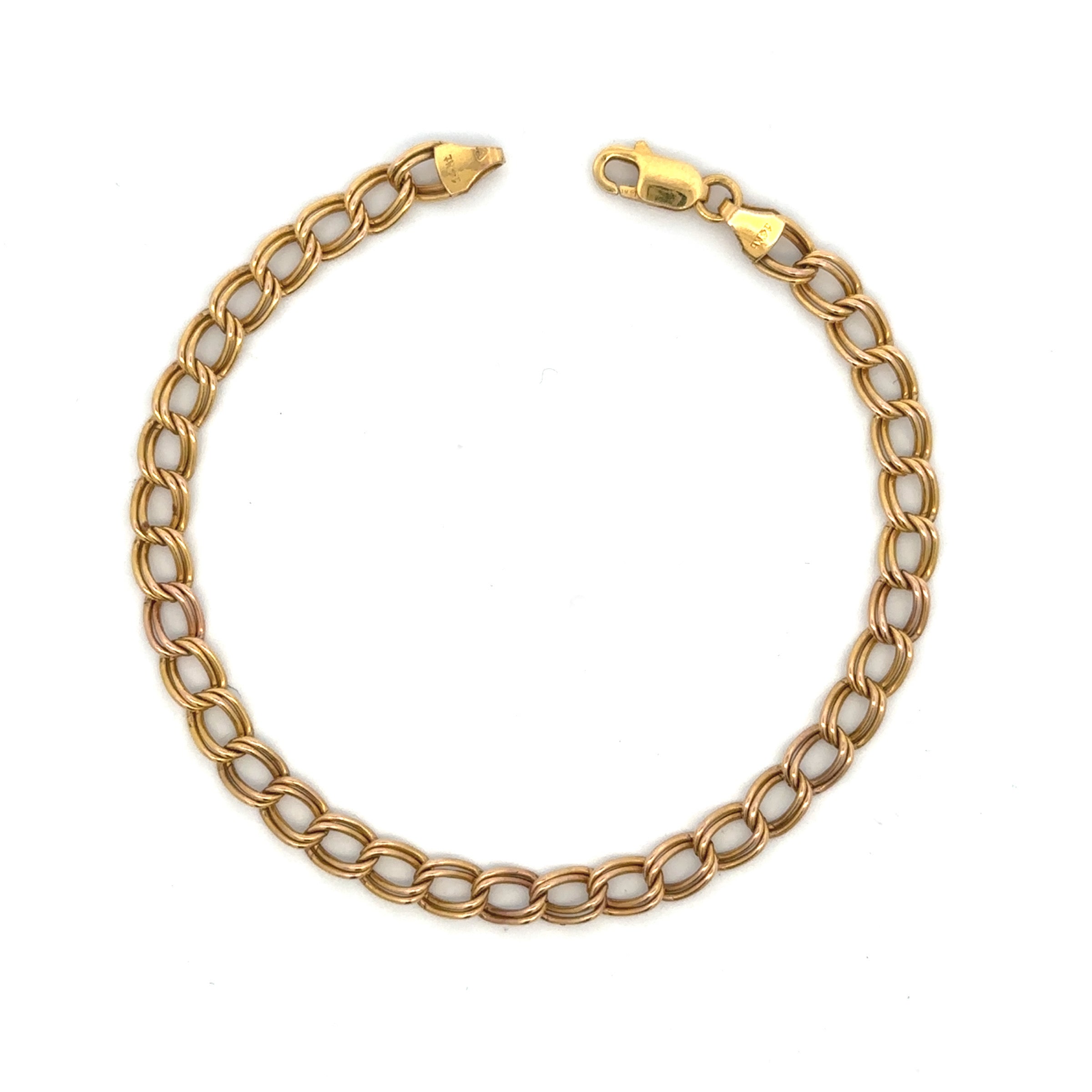 A gold chain bracelet with alternating polished gold links and smooth white inlay links, shown on a plain white background.