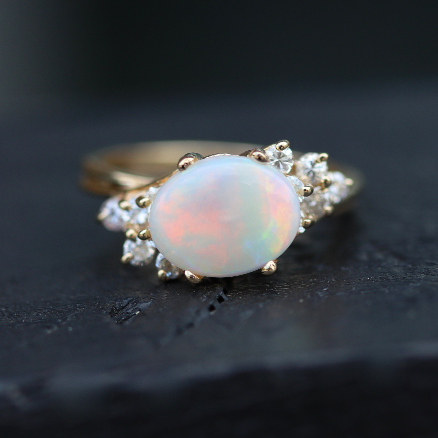 Estate Collection: 14K Yellow Gold East to West Oval Opal And Diamond Accent Ring