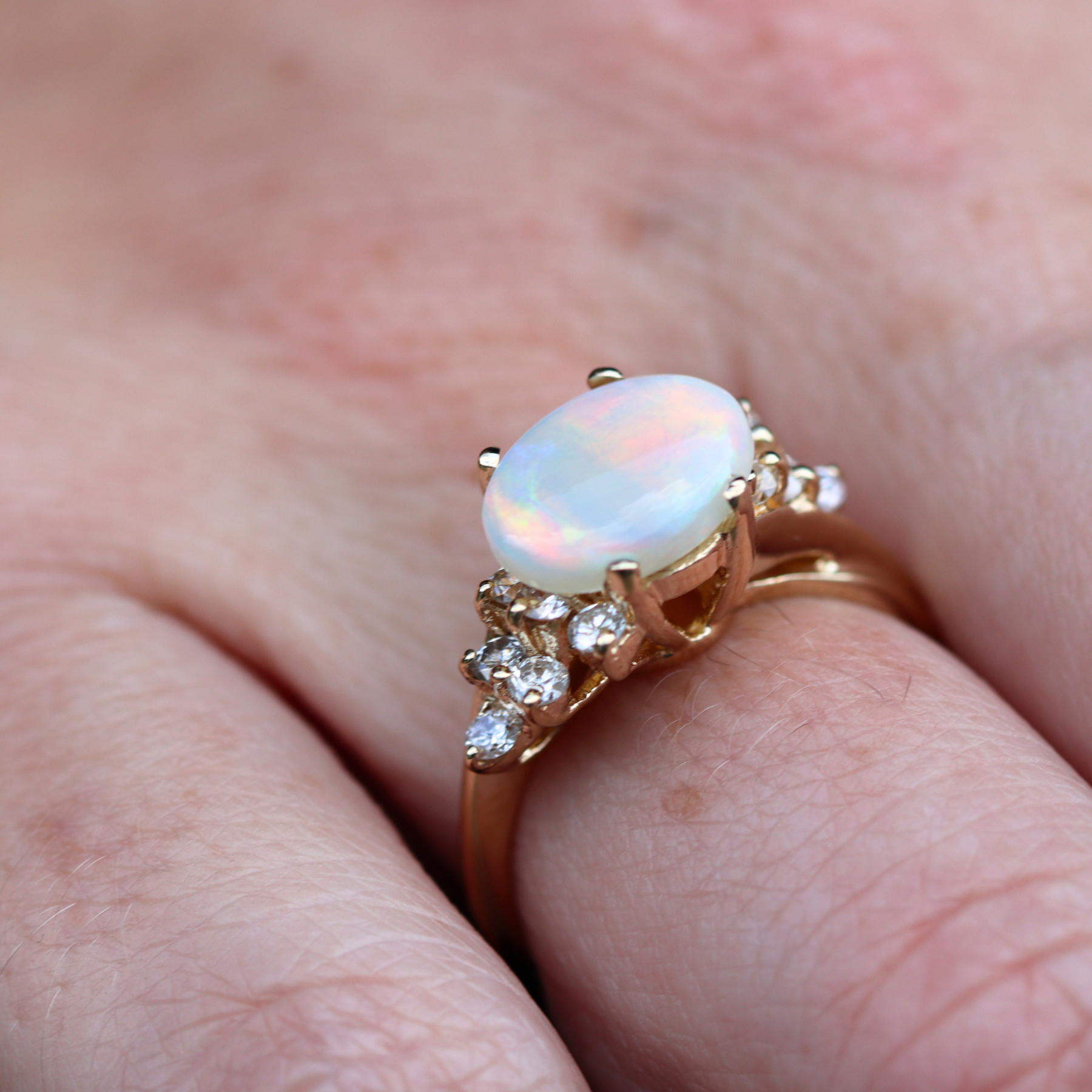 Estate Collection: 14K Yellow Gold East to West Oval Opal And Diamond Accent Ring
