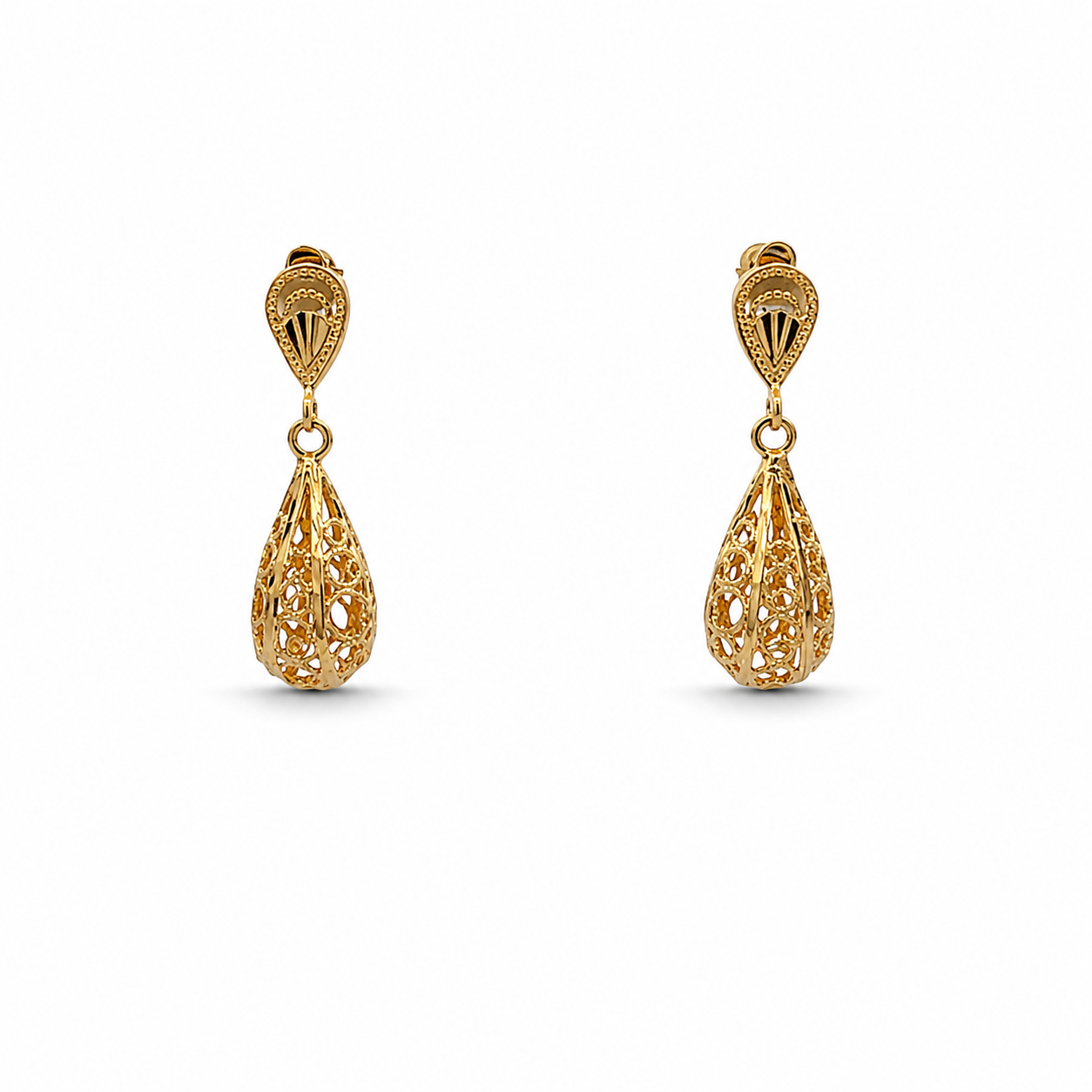 Pair of gold earrings on a white background