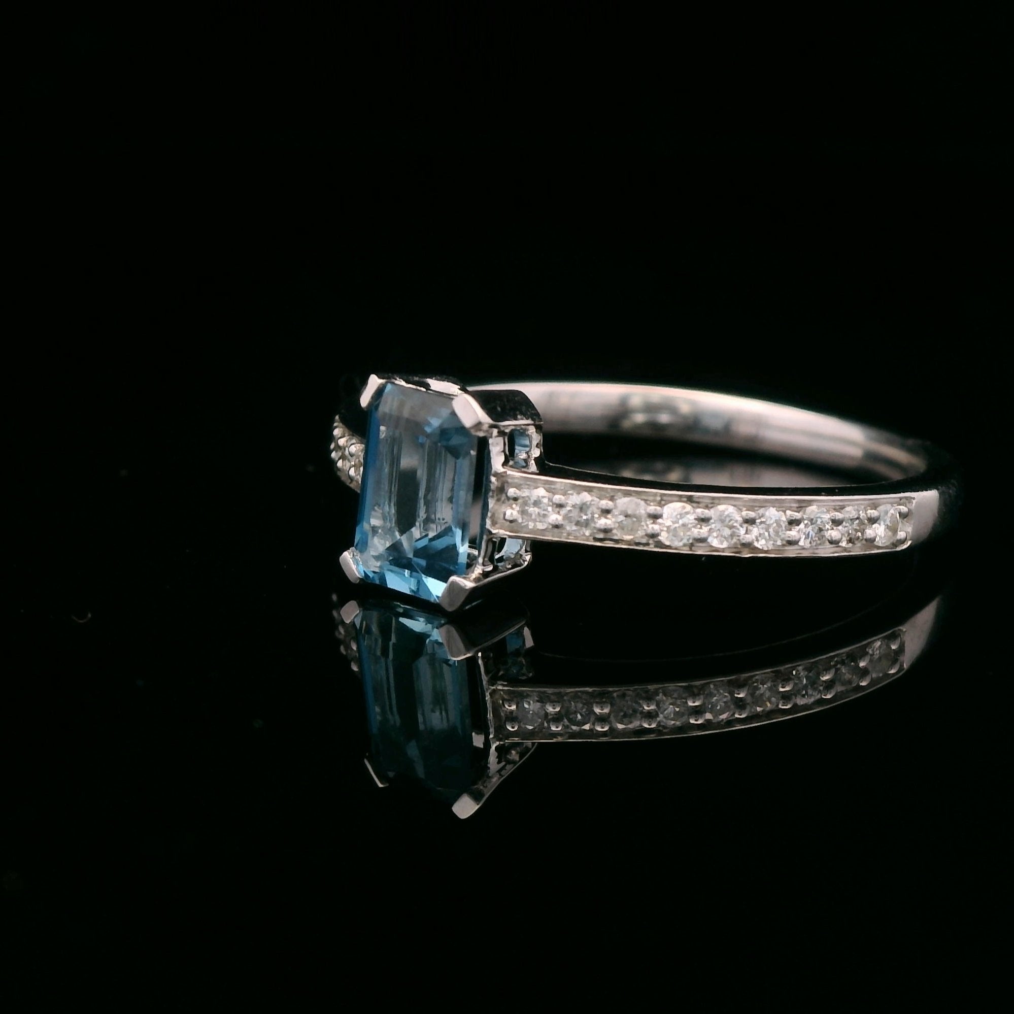 10k White Gold 1/6 CTW Diamond 3/4 CT London Blue Topaz Ring