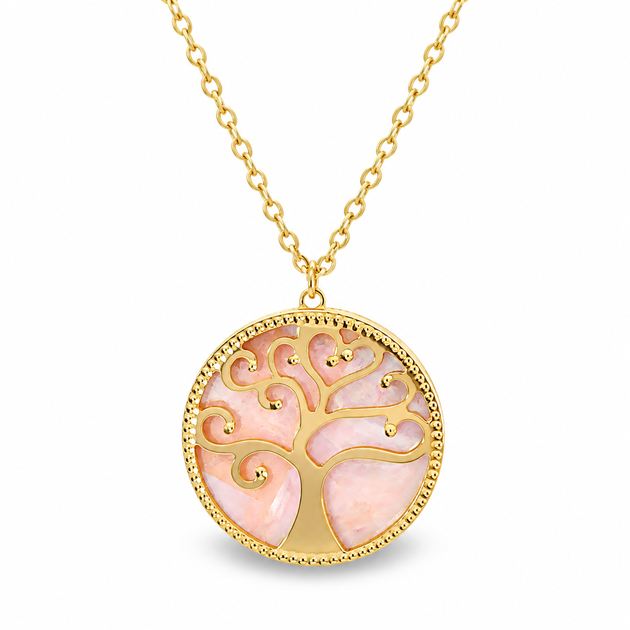 Pink mother of pearl side of a reversible 14K yellow gold Tree of Life pendant necklace.