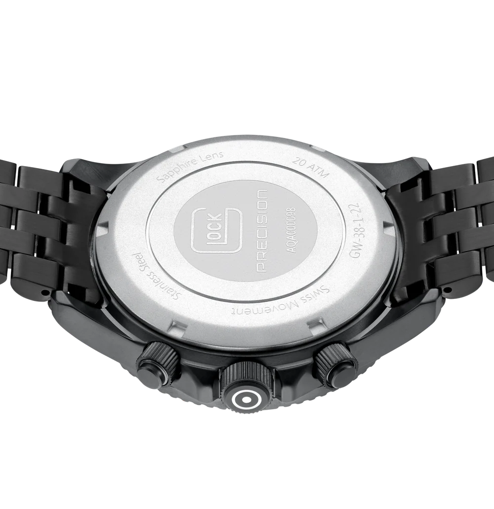 Close-up of a black watch with a metallic back on a white background