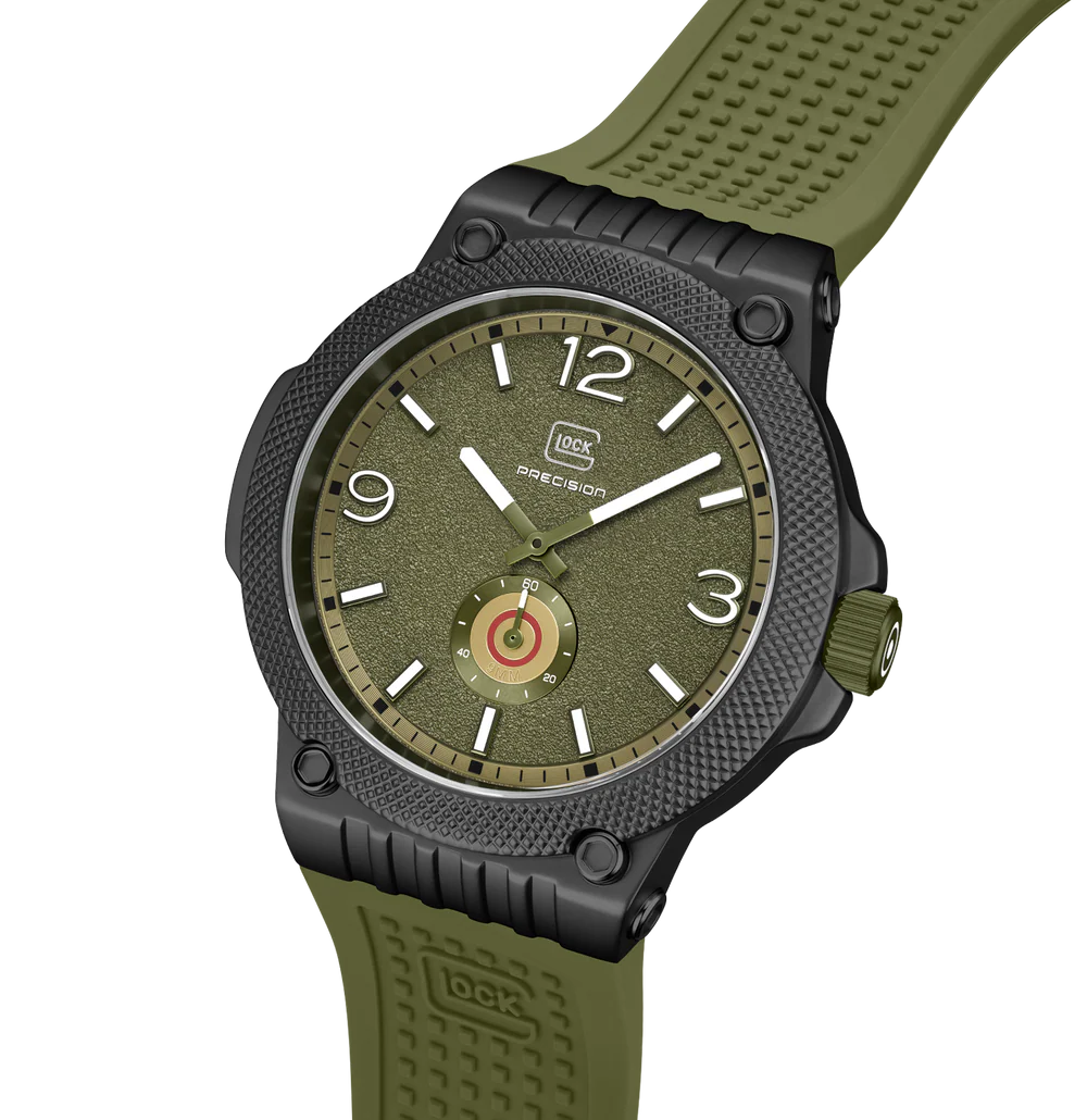 Green watch with a detailed face on a white background