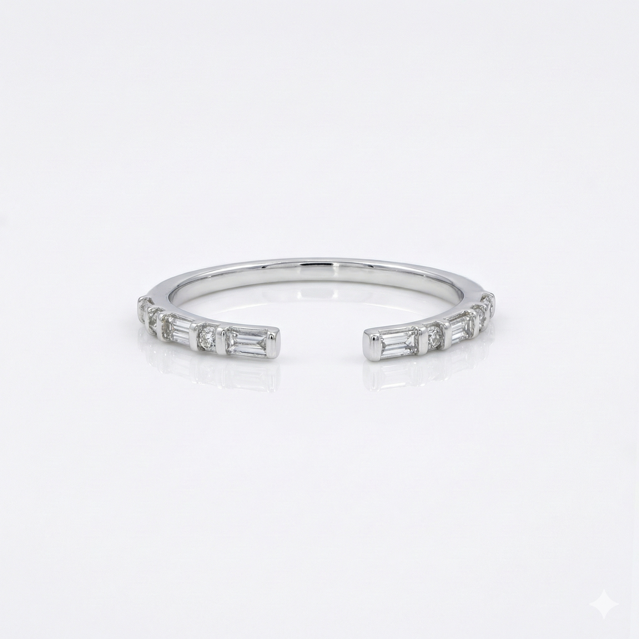 Silver ring with baguette cut diamonds on a white background