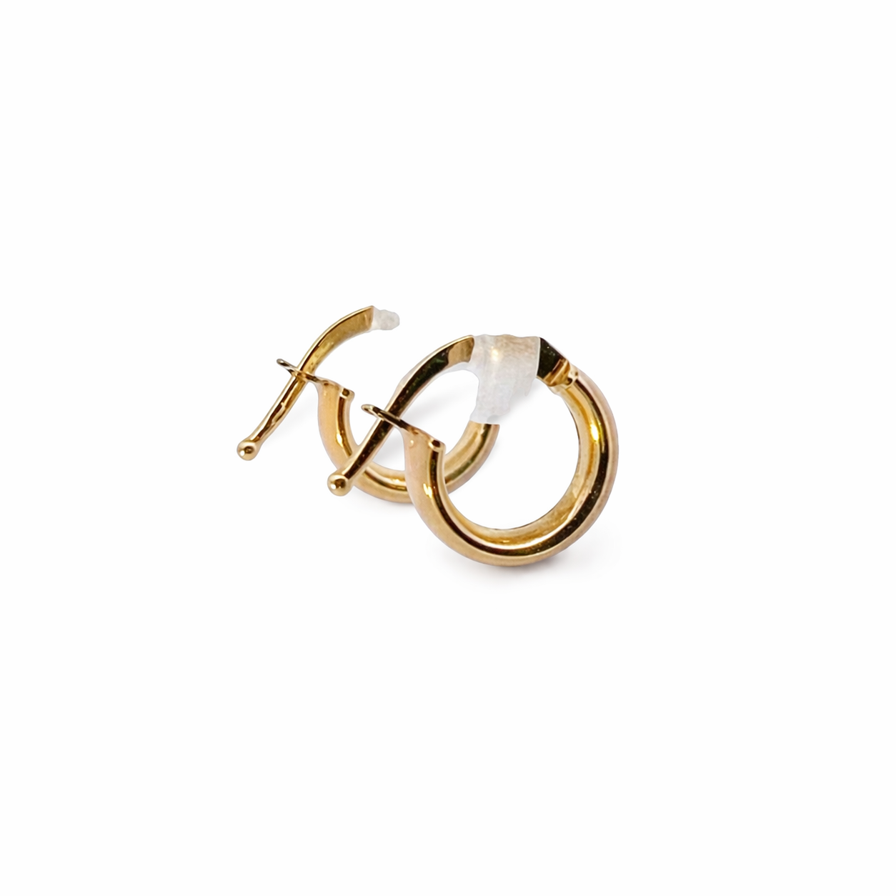 Gold hoop earrings on a white background