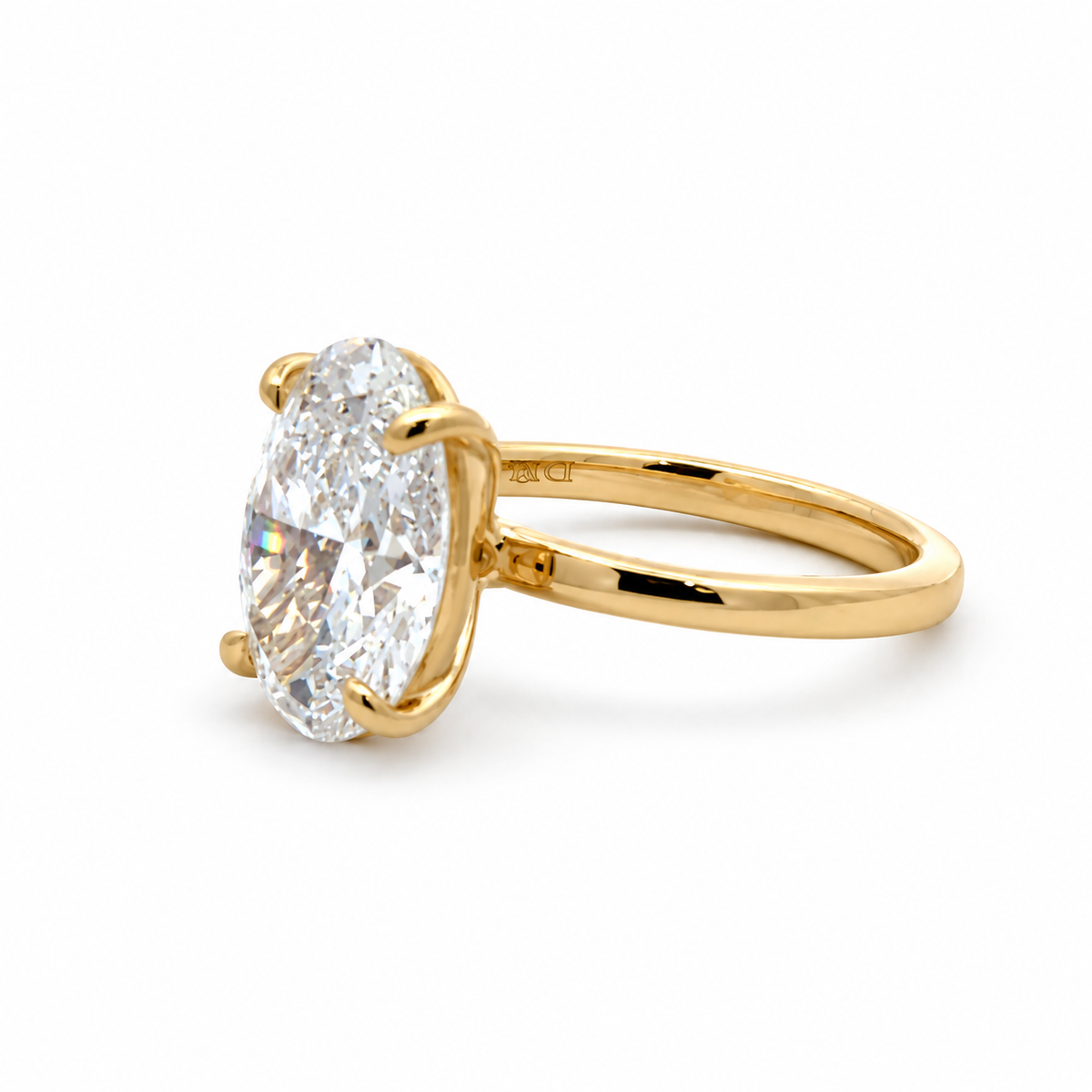 Angled view of the Mia 14K yellow gold 5.02CT. oval lab-grown diamond solitaire ring, with the diamond on the left.