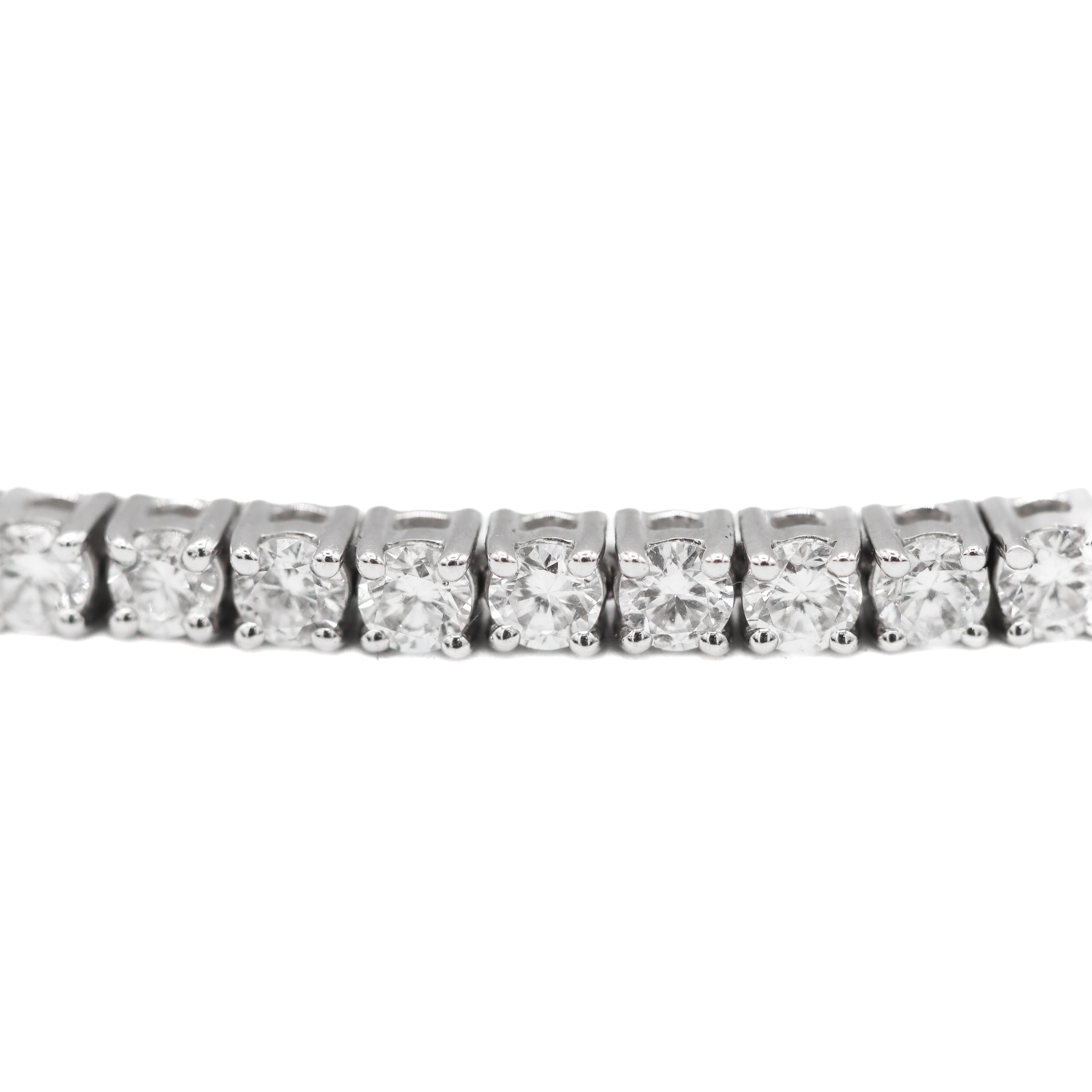 Close up view of the diamonds in the links of this 14K White Gold 3CTW. Lab-Grown Diamond Tennis Bracelet on a white background.