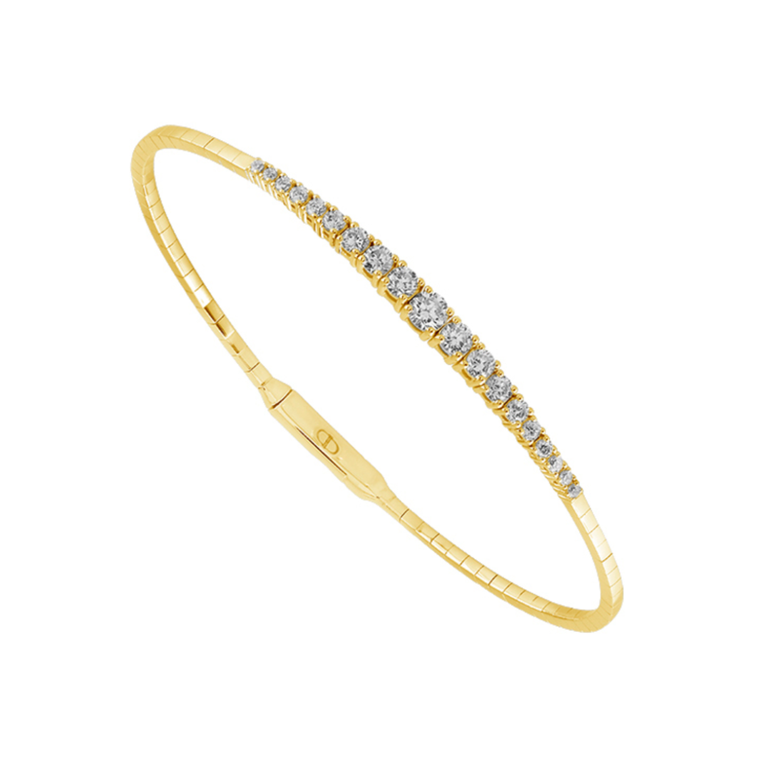 Angled view of 14K Yellow Gold 0.9CTW. Diamond Graduated Design Flexi Bangle Bracelet on white background.