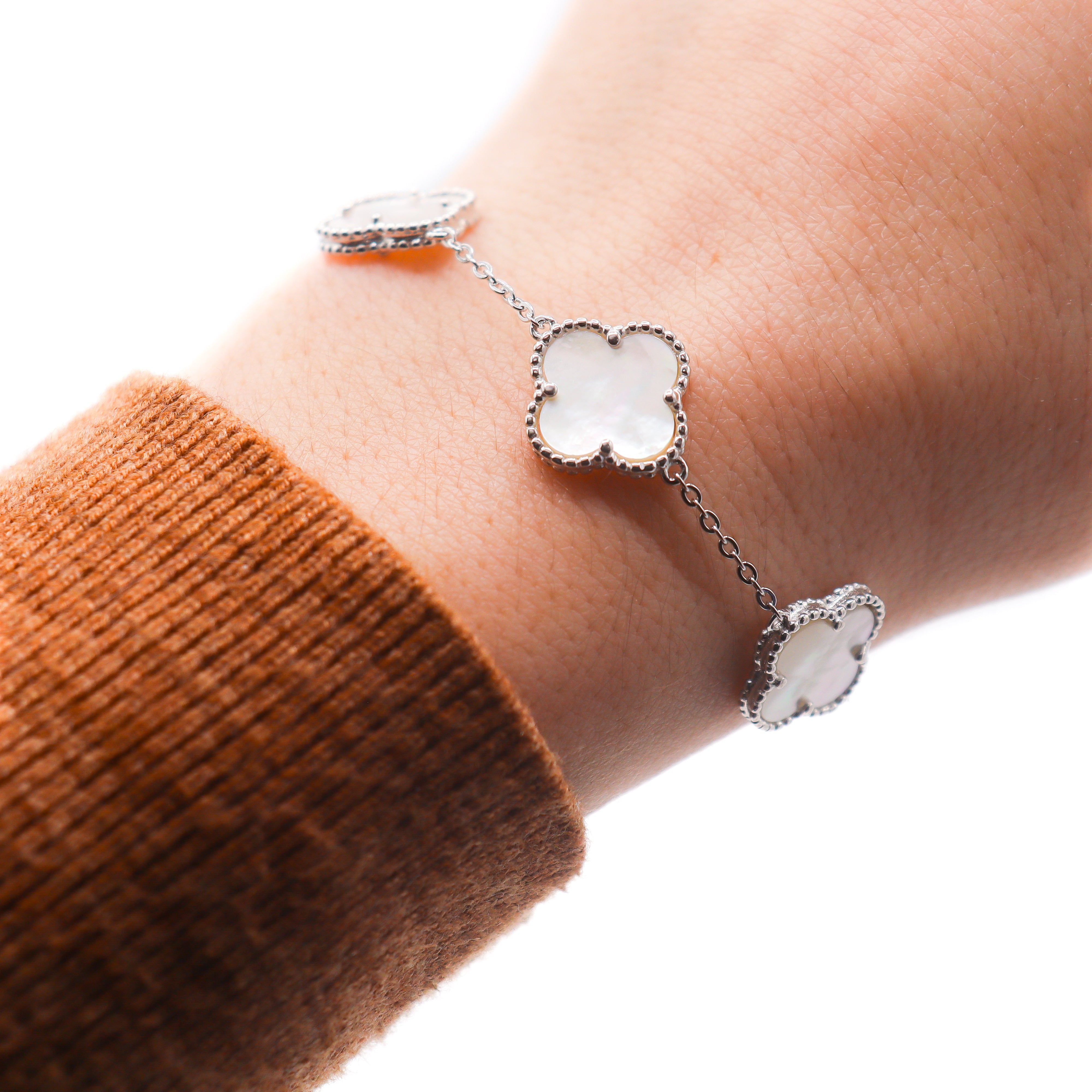 Mother of Pearl Clover Bracelet on a wrist.