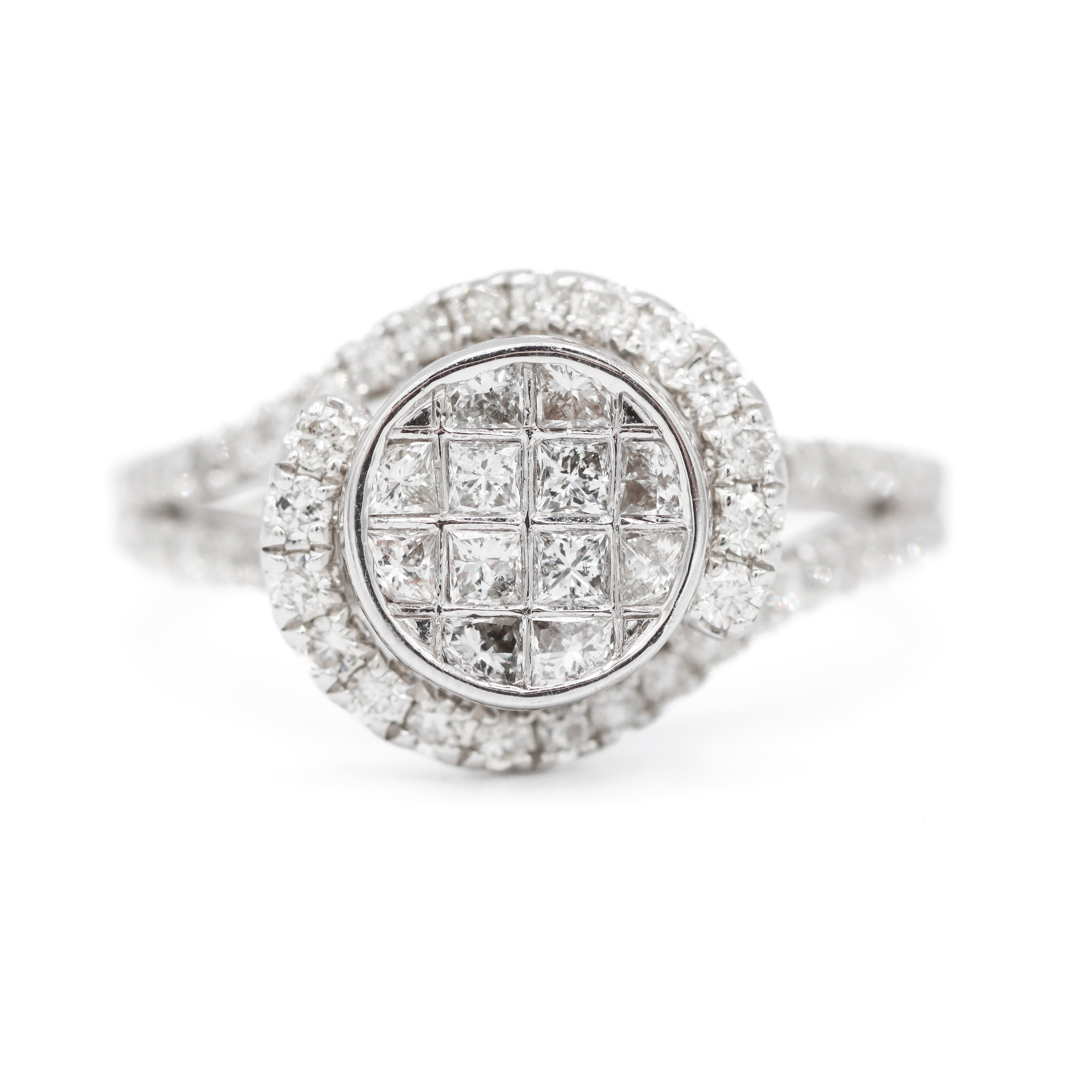 Close up of white gold invisible-set halo twist diamond engagement ring.