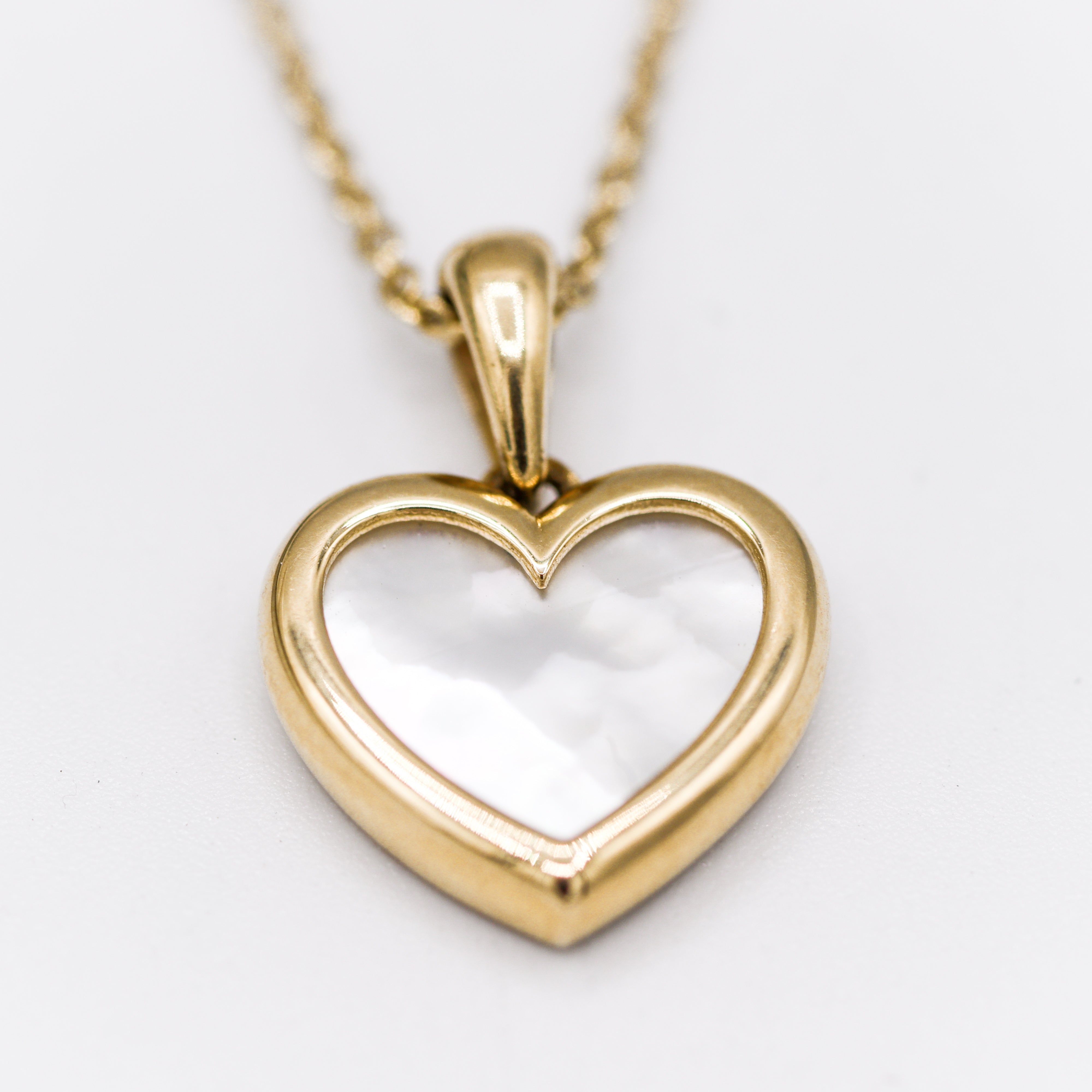 Angled View of Yellow Gold Mother Of Pearl Heart Pendant Necklace