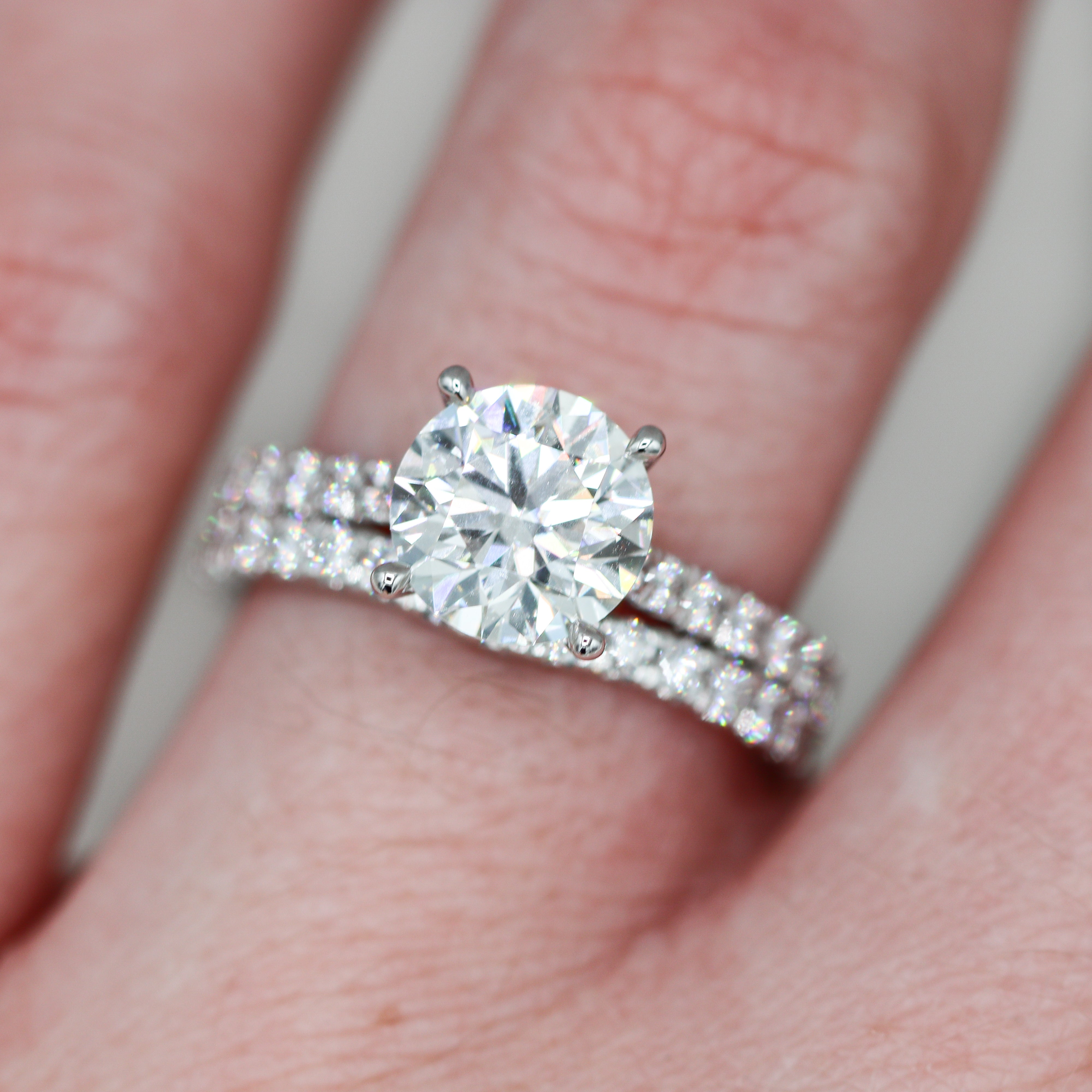 14K White Gold 2.8CTW. Certified Round Lab-Grown Diamond Accented Wedding Set on a hand