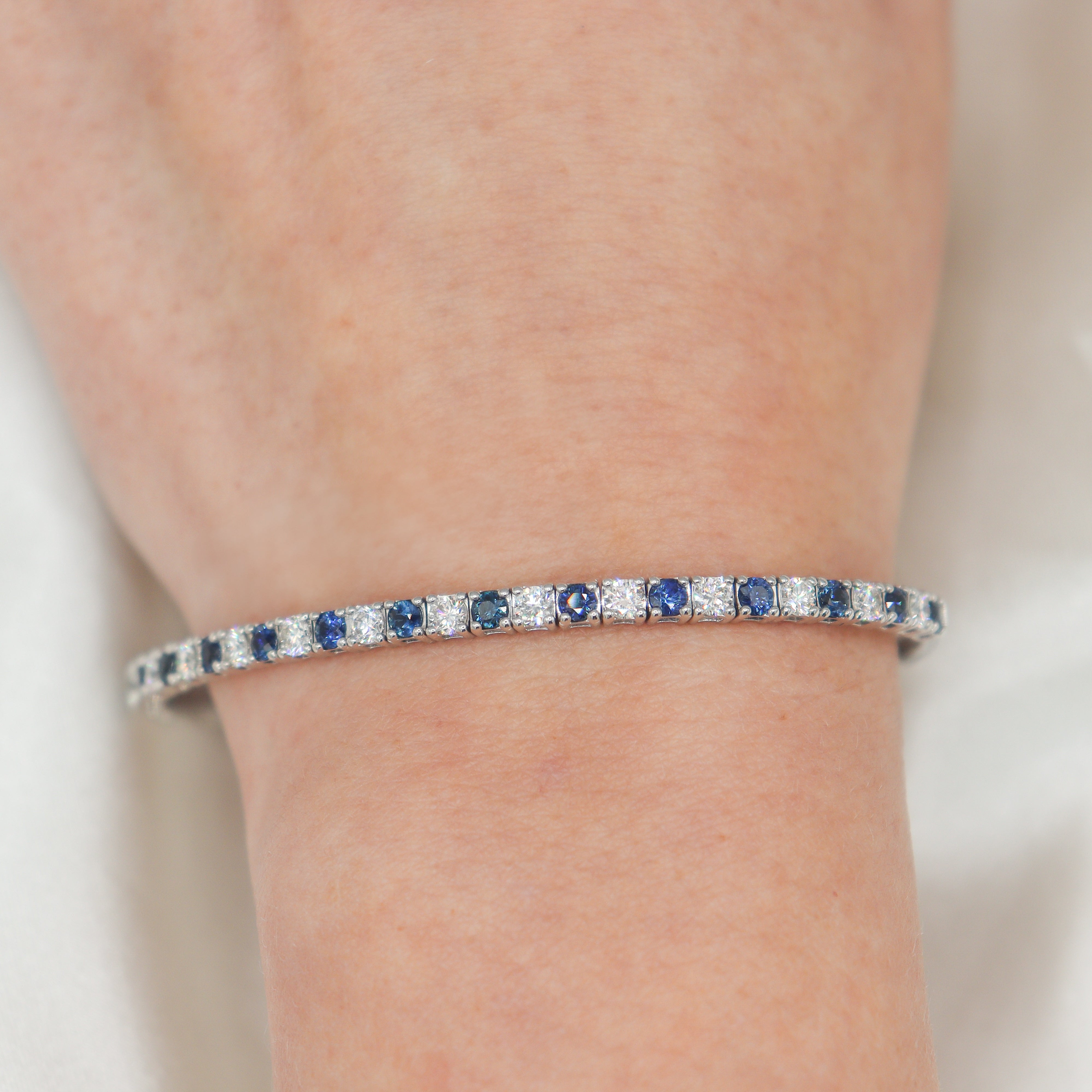 14K White Gold Diamond & Blue Sapphire Alternating Flexi Bracelet on a wrist