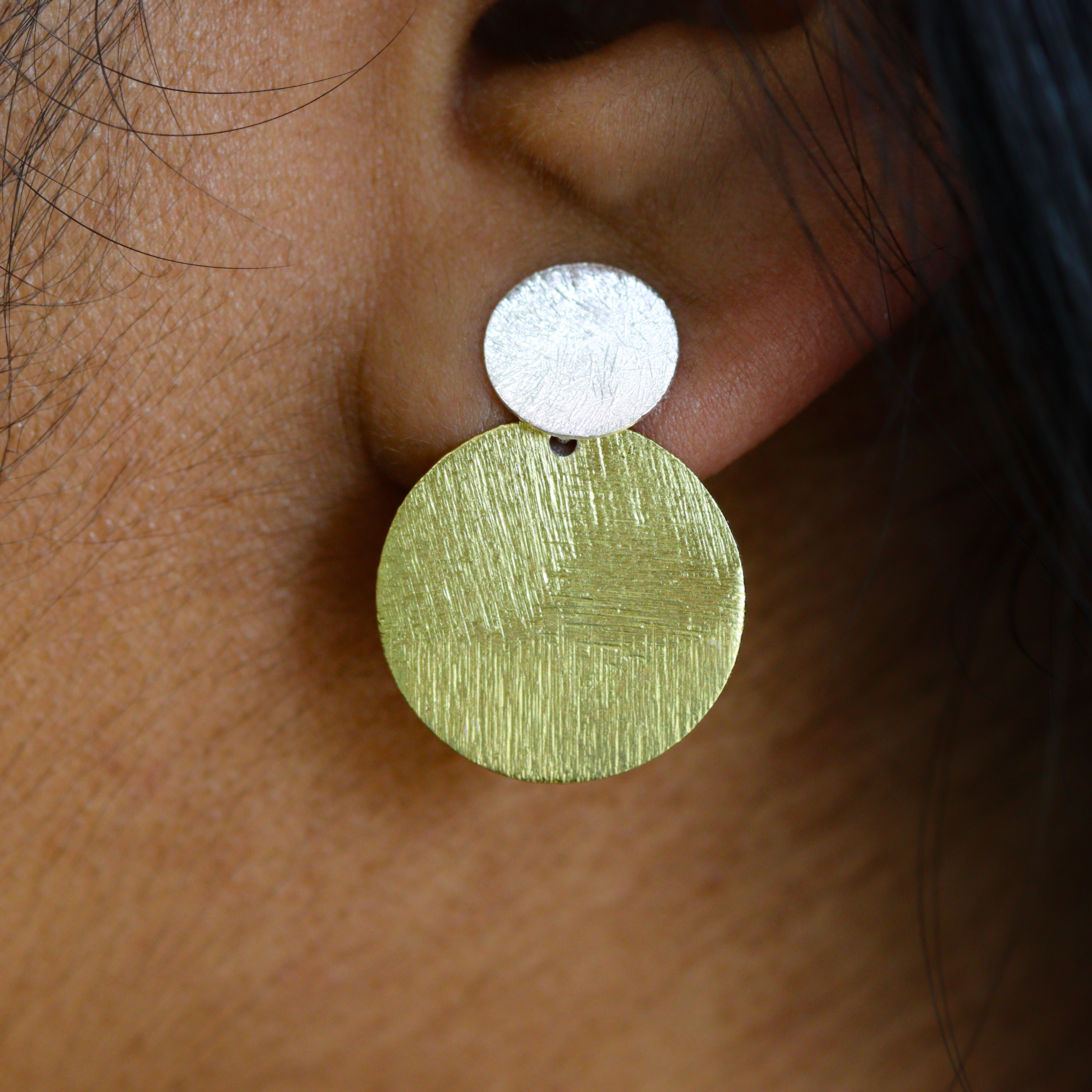 Sterling Silver & Gold-Plated Disc Dangle Stud Earring on a model.