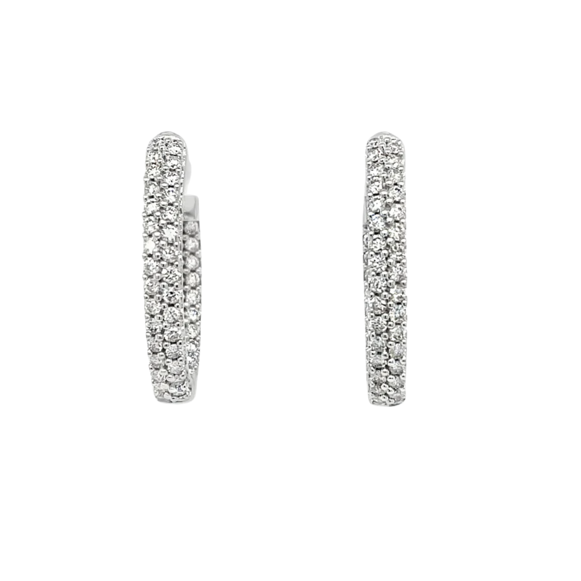 Pair of silver hoop earrings with clear stones on a white background