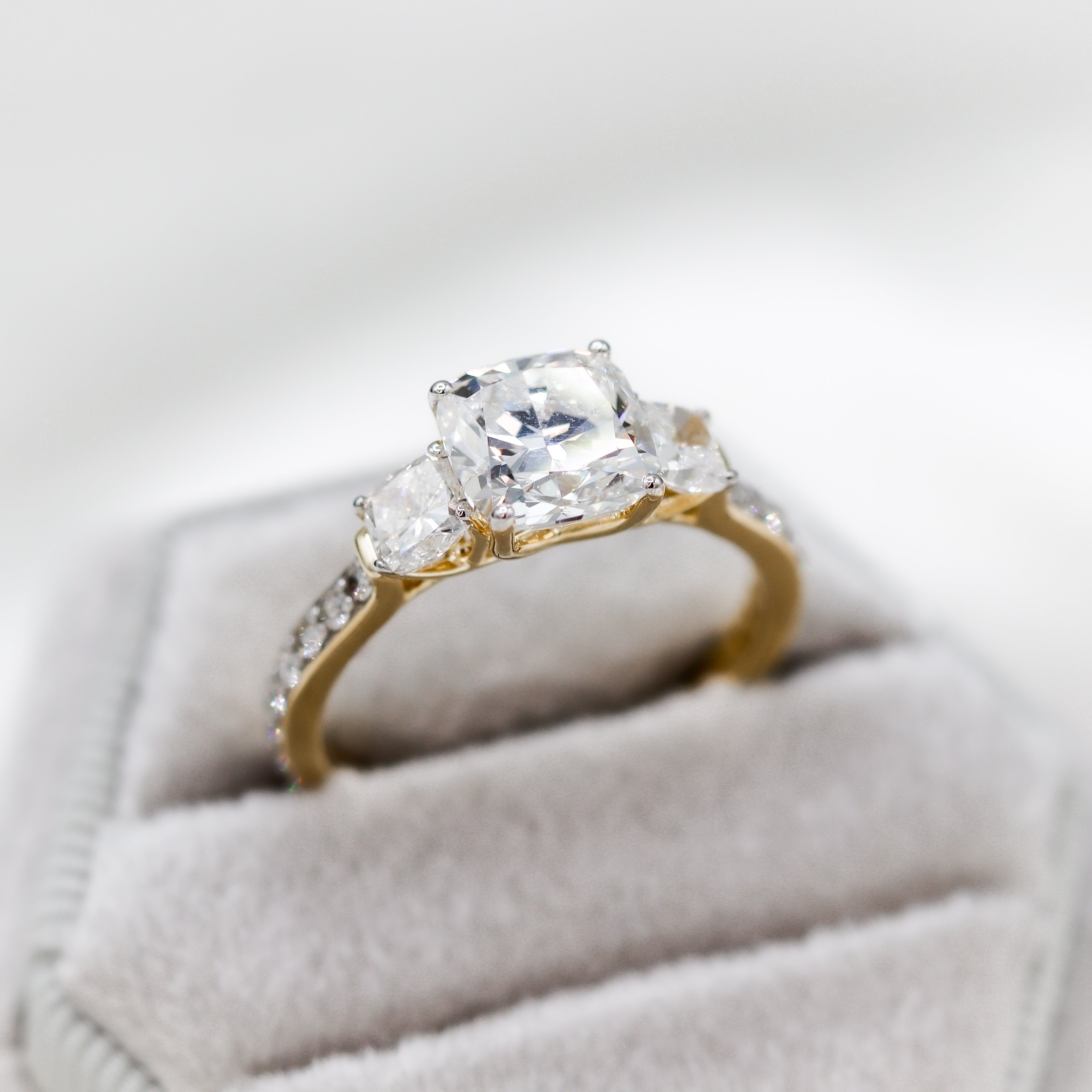 14K Yellow Gold 2.09CT. Center Cushion-Cut Lab-Grown Diamond Accented Engagement Ring in a velvet ring box