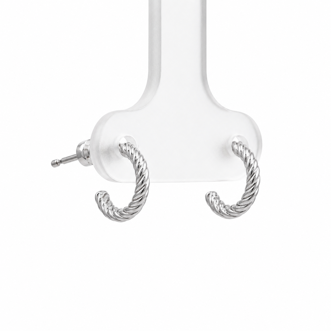 Silver hoop earrings on a white background