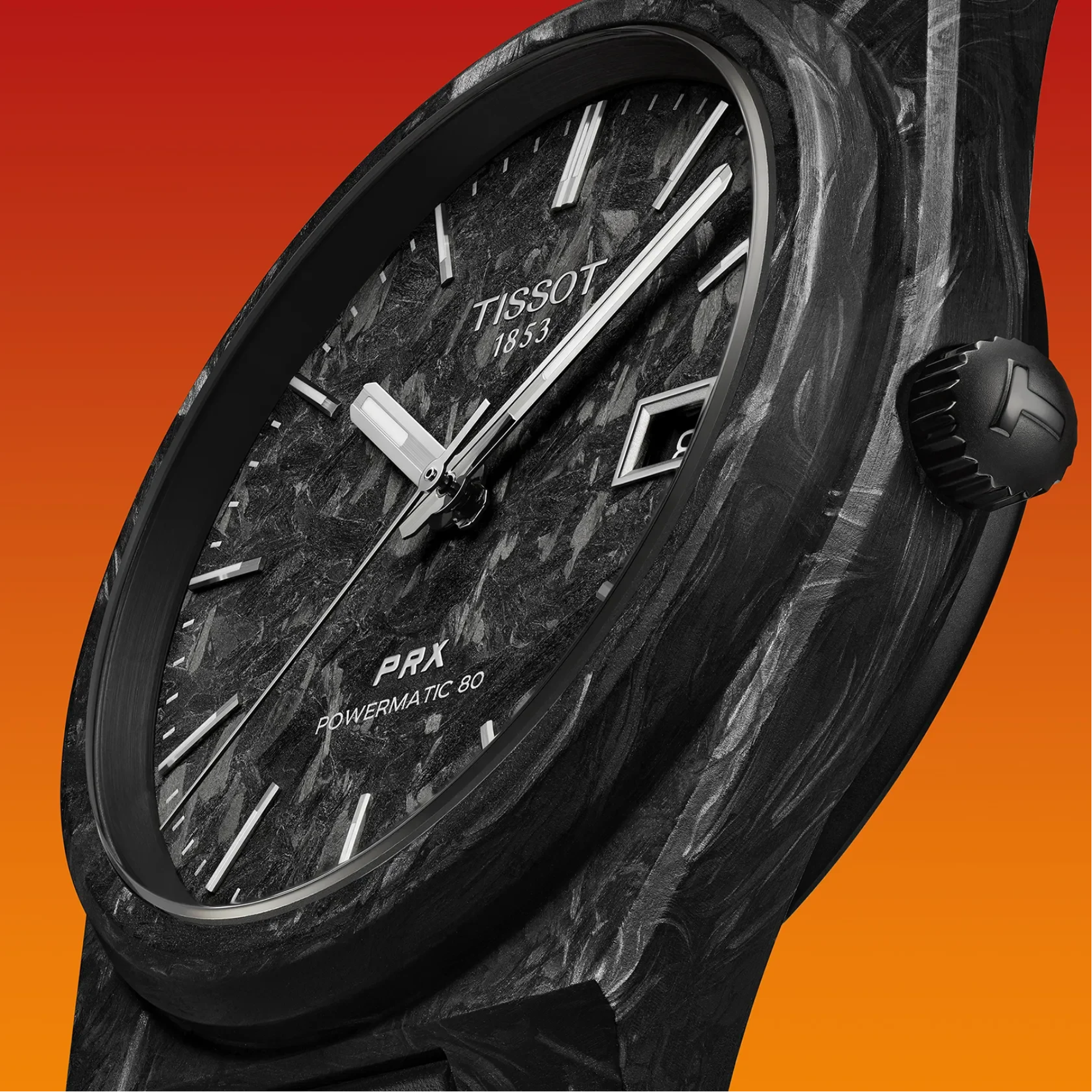 Close-up of a Tissot PRX Powermatic 80 watch with a dark marbled dial and black case, shown against a red-to-orange gradient background.