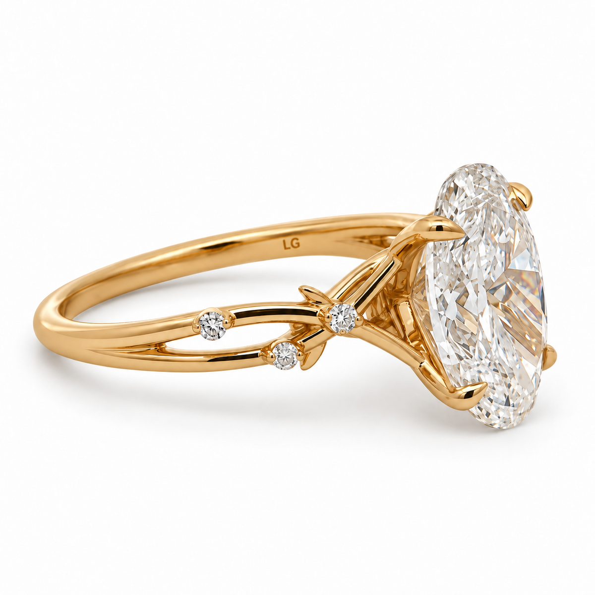 Angled view of the 14K yellow gold oval diamond ring showing its open vine-style shoulder and round diamond accents.