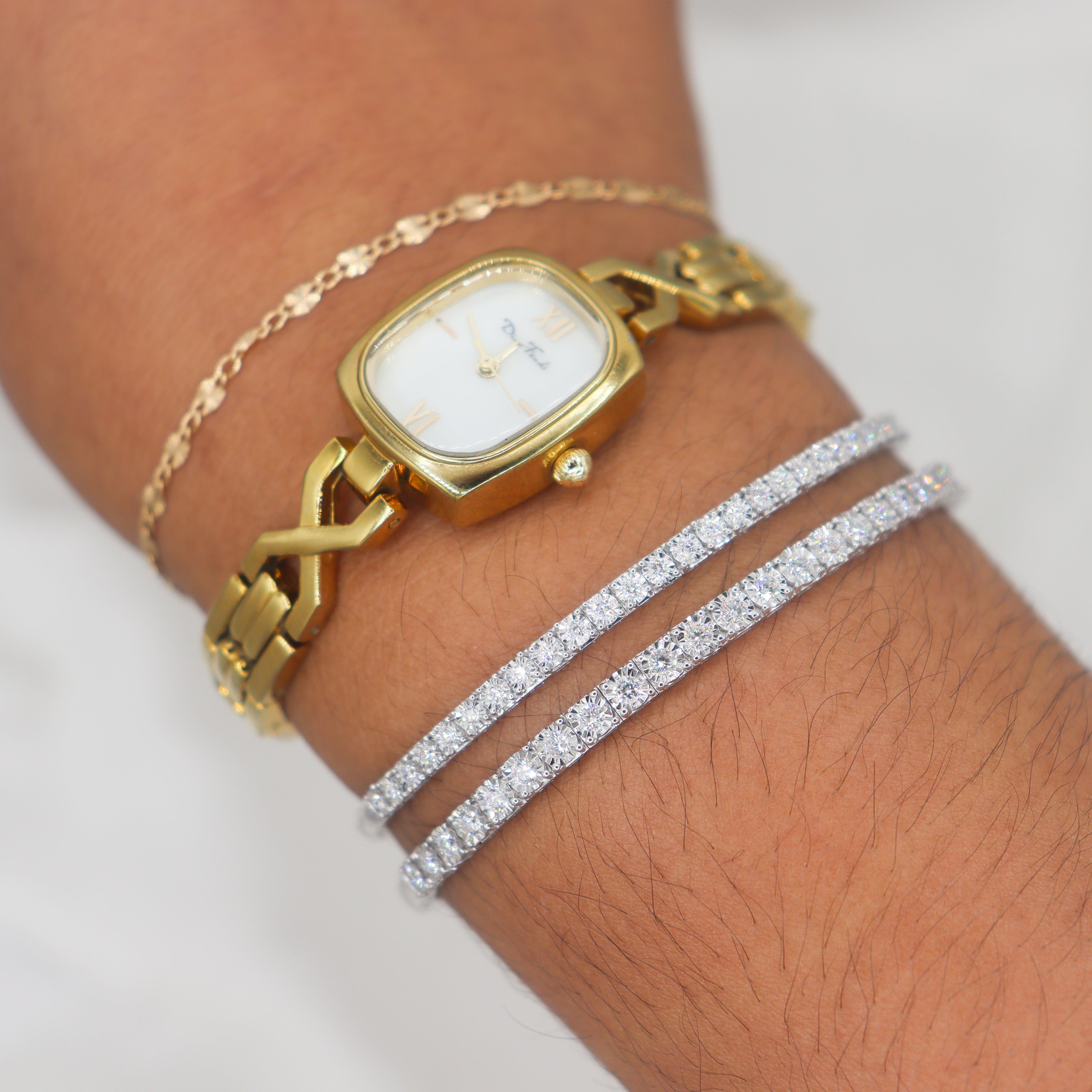 Sterling Silver 1CTW. Lab-Grown Diamond Flexi Bangle Bracelet on a wrist with the 0.5CT. Version too