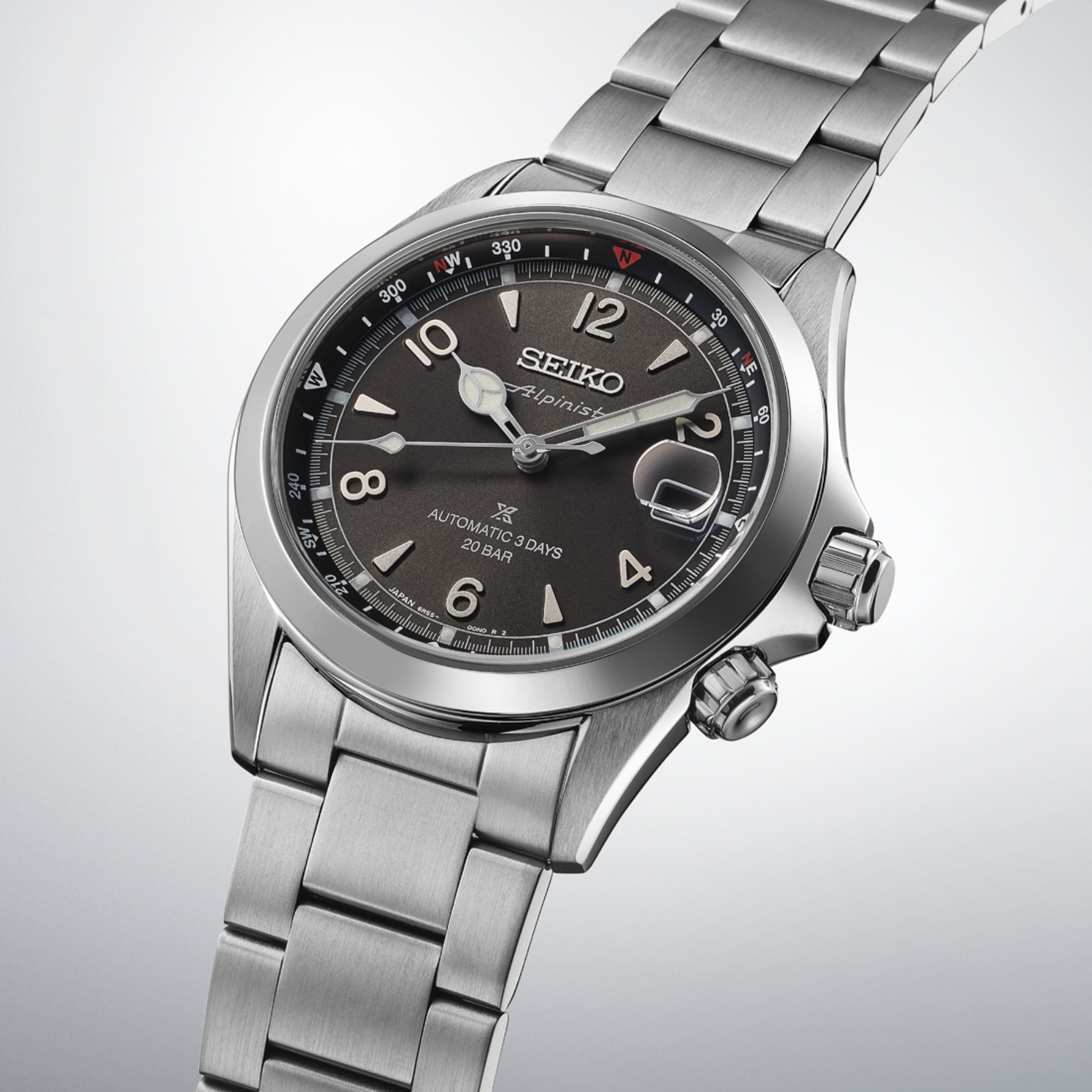Seiko watch with silver metal bracelet on a light gray background