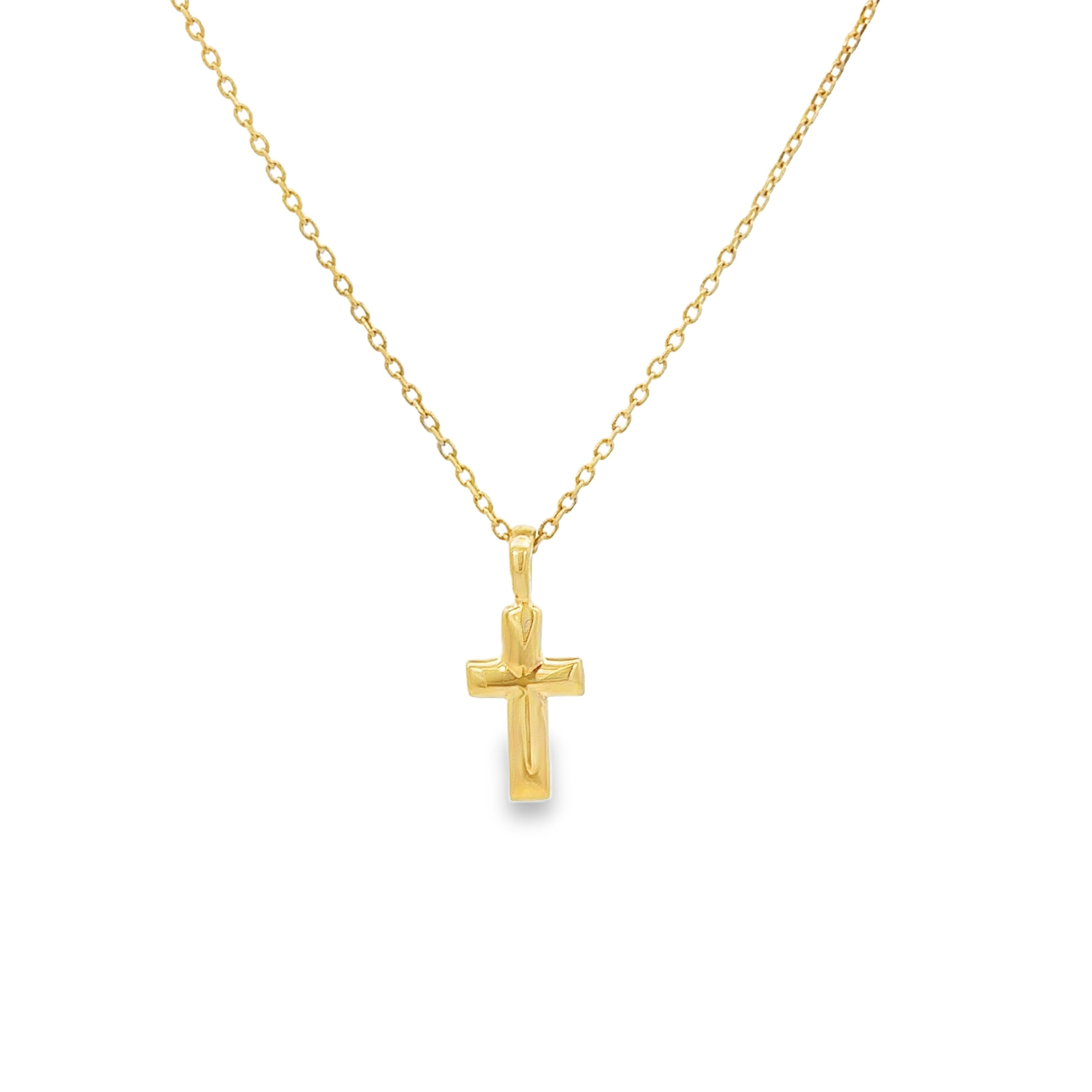 Gold cross pendant necklace on a white background